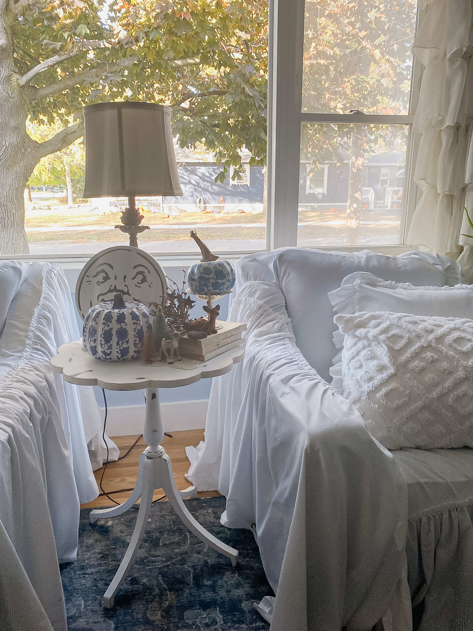 Soft mornings & autumn light 🍂
Nothing beats this view when the leaves start to turn — cozy slipcovered sofas, a vintage lamp, and blue-and-white pumpkins that add just the right touch of charm. Mixing patterns and textures keeps it feeling inviting but not fussy.

💙 Tap to shop my favorite fall decor finds and recreate this cozy corner in your own home.

#CozyFallHome #ThanksgivingDecor #BlueAndWhiteDecor #FallVibes #LTKhome #LTKholiday #julieannrachelleinteriors #InteriorStyling #CozyCorner 

 #LTKSeasonal #LTKFindsUnder50 #LTKFamily