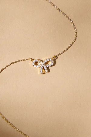 18K Gold Dimond Studded Bow Necklace in Gold | Altar'd State | Altar'd State