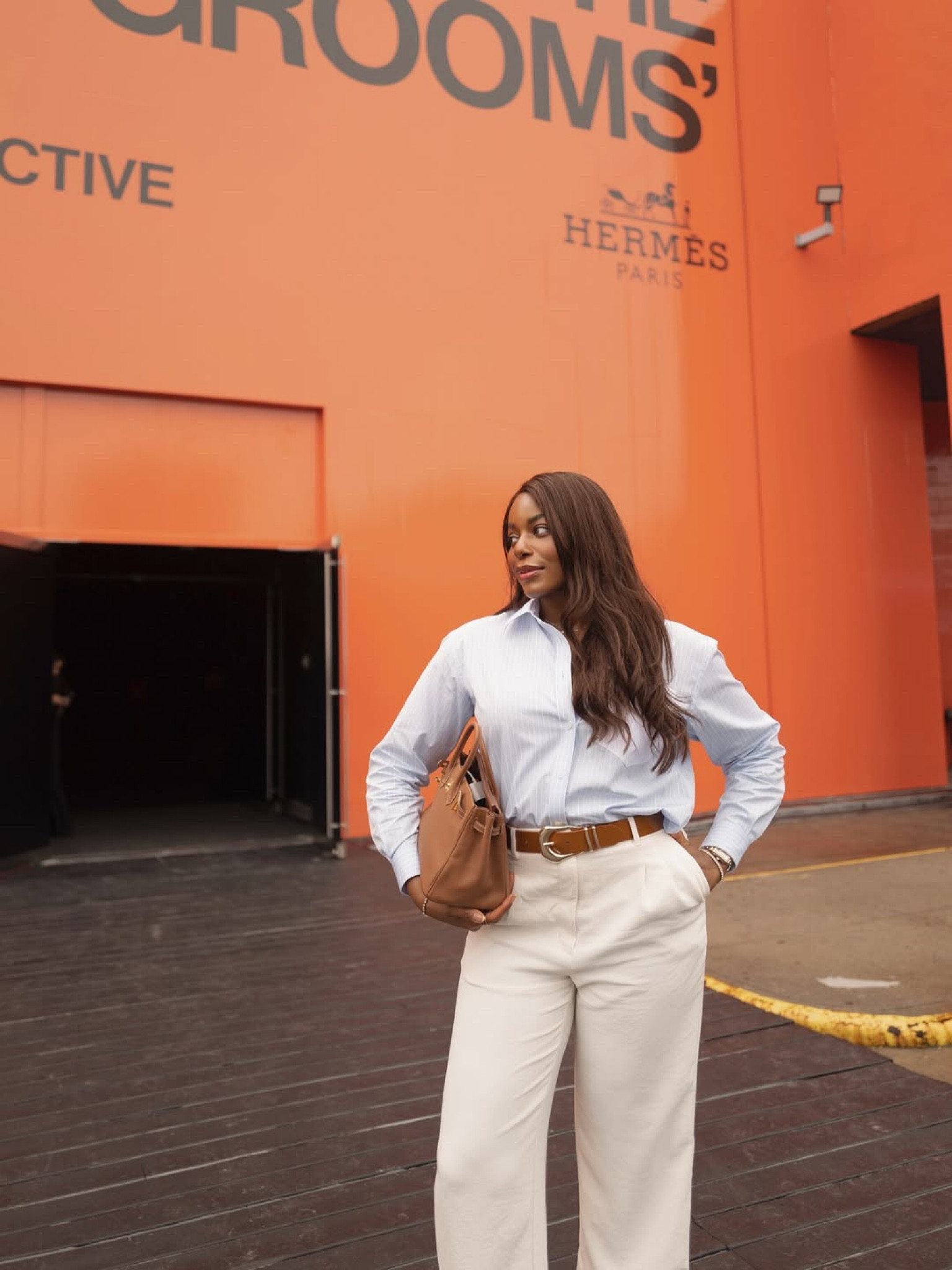 Stepping out to visit the Hermes interactive detective experience in NYC! Such a fun event that I recommend everyone visit. Wearing a blue striped button up shirt, white trousers, nude ballet flags, Hermes bag. Linking my outfit details below! Perfect workwear outfit idea and more … For more links to summer coffee table decor, wedding guest dress, summer nails, melissa murrelll, wedding guest, summer outfits, georgia louise, ubeauty, 4th of july looks, follow me on LTK! ✨

#LTKWorkwear #LTKStyleTip #LTKSeasonal