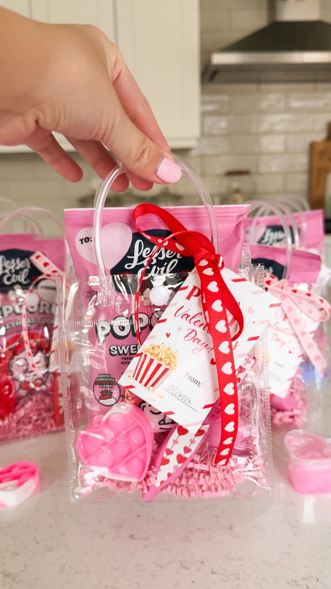 Valentine's Day class gift idea! 

Clear bags, ribbons, valentine’s day gift tags, popcorn, party favors, plastic kazoos, pop its, , fidget toys, shredded paper for gift baskets

#LTKHome #LTKValentine #LTKKids