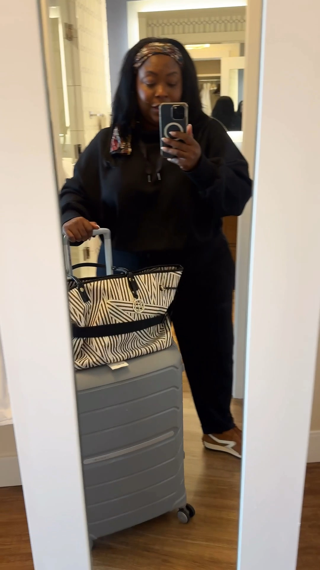 Wearing my favorite travel outfit, the Air Essentials collection by Spanx (2X), is so comfortable. I’ve had this set for at least four years, and it still looks new.

I loved that the top has a high neck but does not have a hoodie, and the pants are adjustable with a drawstring. The only negative, I think, is that there are no pockets, but typically when I’m traveling, I have a bag with me, so I don’t necessarily need them.

For my shoes, I went with the Rag & Bone sneakers, and my favorite travel brand is Samsonite because the luggage is so durable. 

#LTKActive #LTKOver40 #LTKTravel