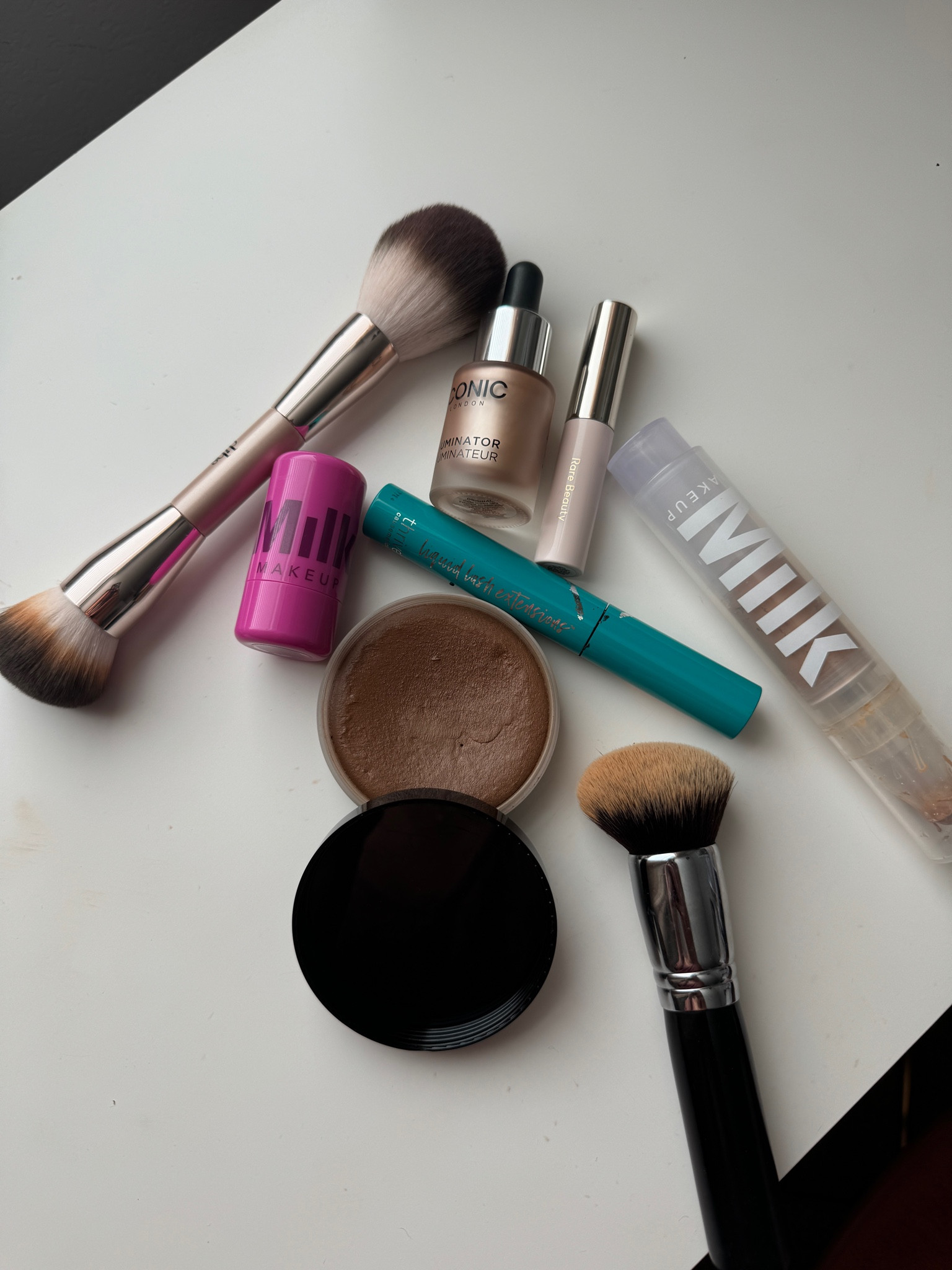 Milk skin tint, shade golden honey // Saie sun melt, shade tan bronze // Milk Jelly Tint, shade Splash // Iconic liquid illuminator, shade original 

#LTKBeauty