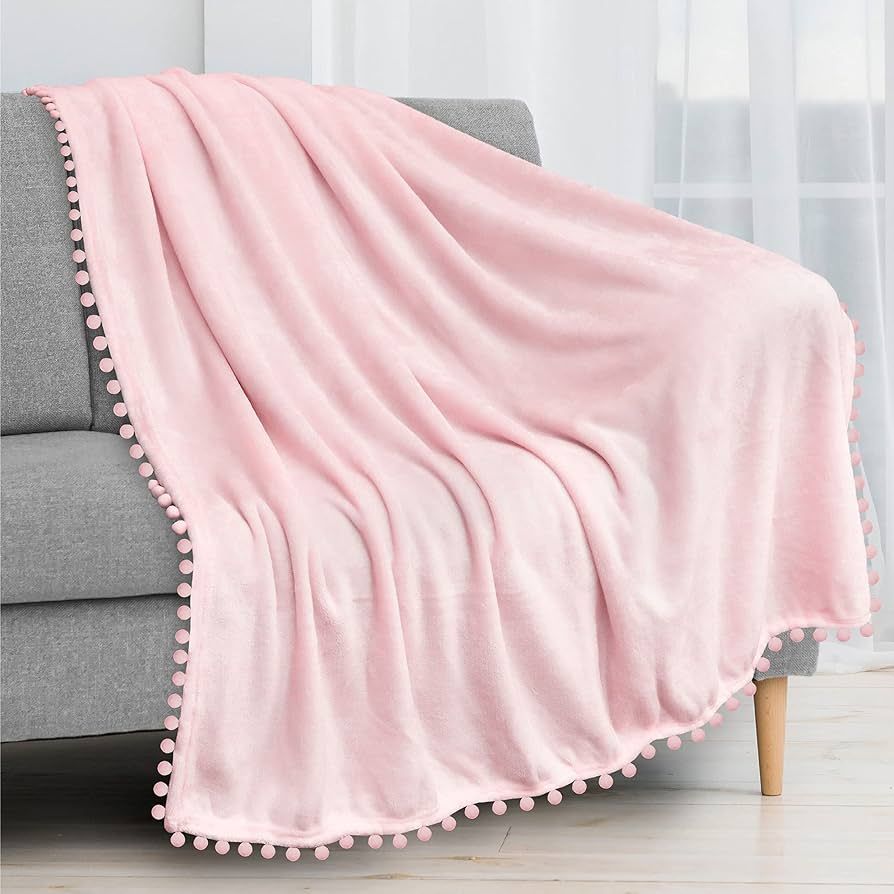 PAVILIA Light Pink Throw Blanket Pom Pom for Couch Bed Sofa, Fleece Soft Fuzzy Cozy Lightweight P... | Amazon (US)