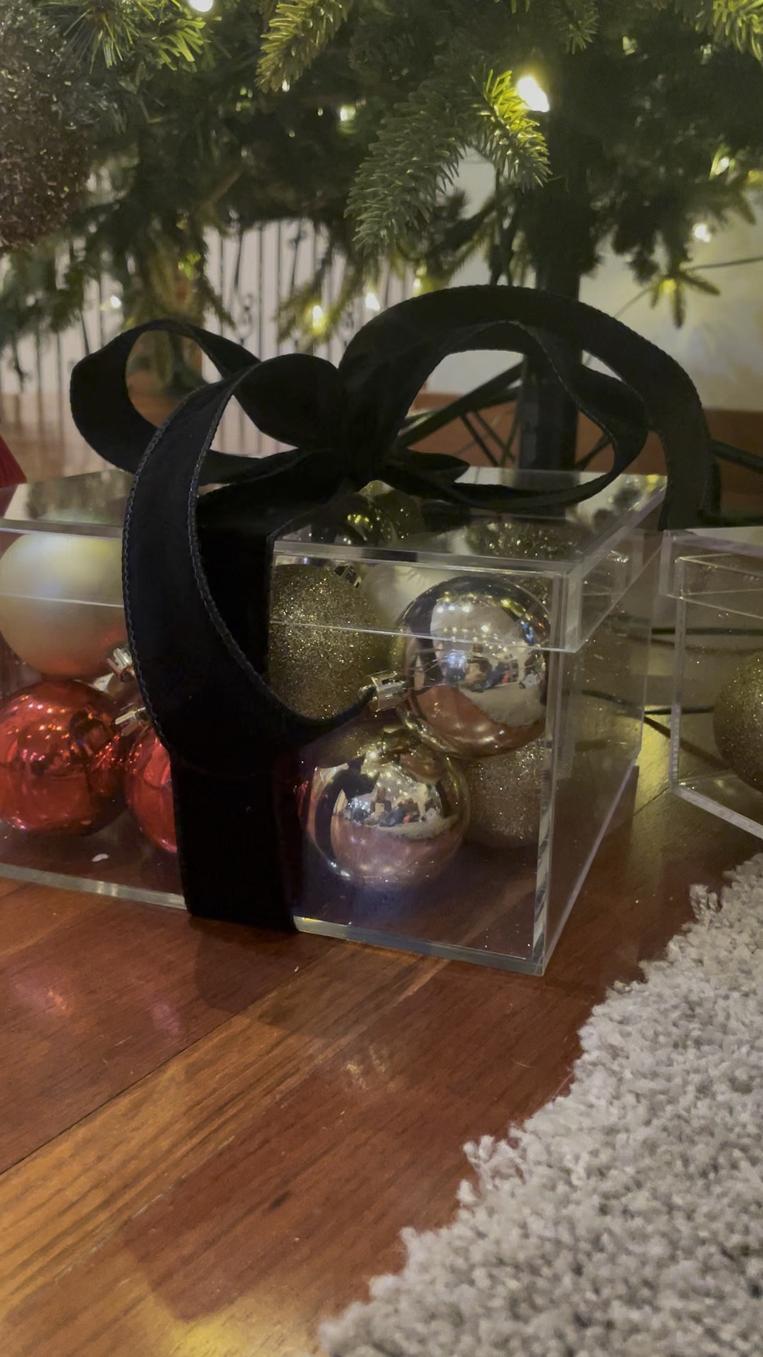 How cute is this acrylic boxes filled with ornaments wrapped with a velvet black bow perfect for underneath the tree such a cute home decor item for the holidays Christmas

#LTKSeasonal #LTKHome #LTKHoliday