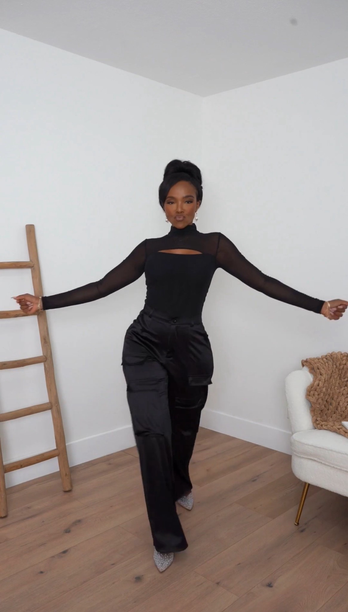 Sleek, modern, and a little edgy — this all-black look mixes a sheer-sleeve mock-neck top with fluid satin cargo pants for a chic twist on evening dressing. Effortless shine meets clean lines, making it a standout without feeling overdone.

Perfect for winter nights out, holiday dinners, and elevated casual-glam plans.

all-black outfit inspiration, sheer mock-neck top styling, satin cargo pants look, winter night-out fashion, elevated monochrome style, modern holiday outfit ideas.

📏 Sizing: Top (Small) • Pants (Small)
Measurements: 5’4” · 138 lbs · 34D · 27” waist · 40” hips

✨ Everything linked below for easy shopping

Follow me on Instagram and YouTube @kirasfashionfinds

#LTKHoliday #LTKootd