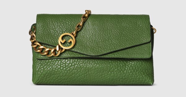 The House's contemporary handbag silhouettes meet emblematic motifs. This sleek style features th... | Gucci (US)