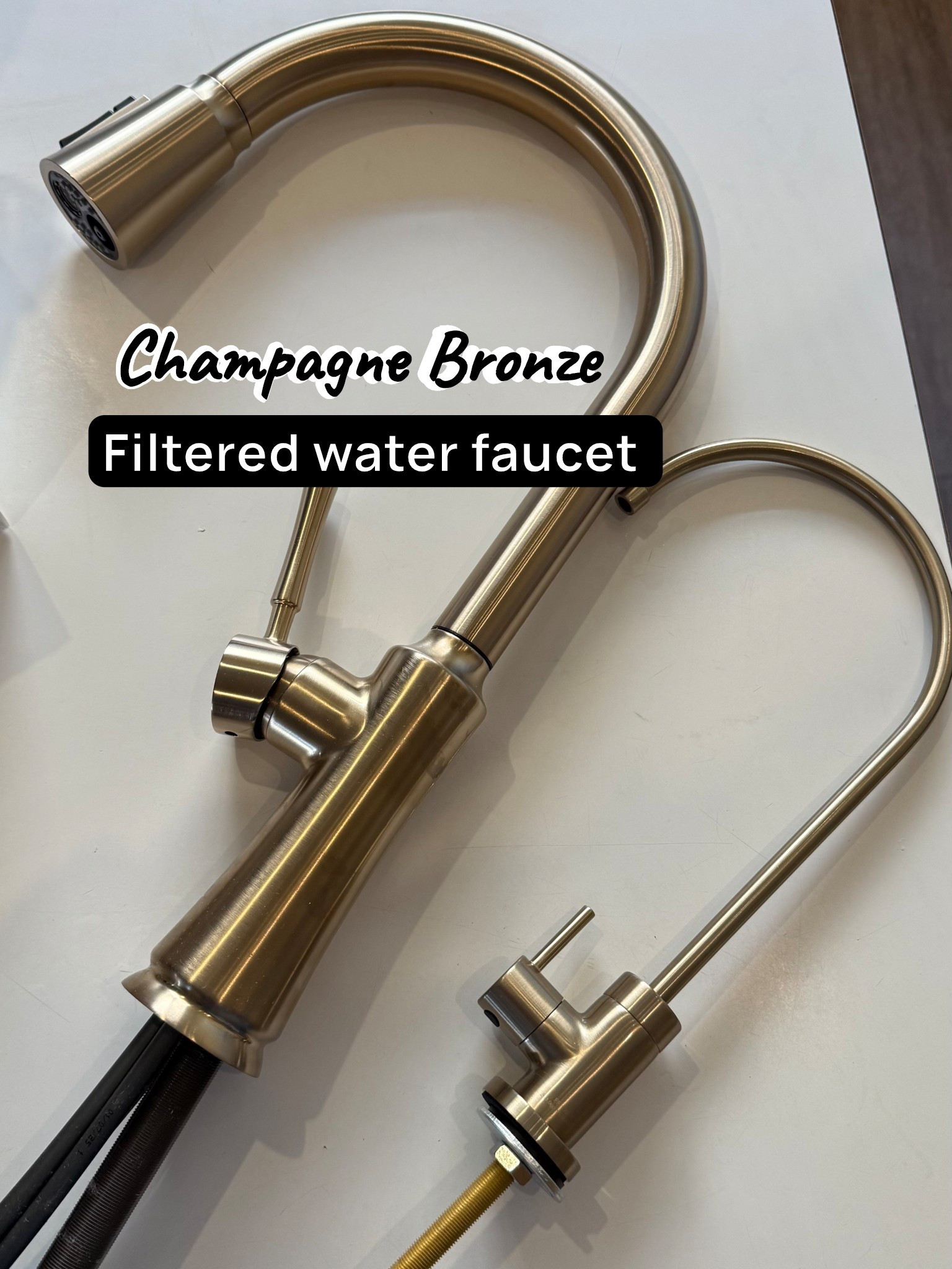 Kitchen faucet!! Our RO faucet arrived and it’s a perfect match for our kitchen faucet! Champagne bronze is such a difficult color to match so when you find a perfect match, it’s so exciting!! 

•
•
Champagne bronze, delta champagne bronze, kraus champagne bronze, gold faucet, champagne bronze faucet, chalet faucet, ro faucet, beverage faucet, filtered water faucet, kitchen faucet, kitchen sink, kitchen remodel  



#LTKHome #LTKSaleAlert #LTKCyberWeek