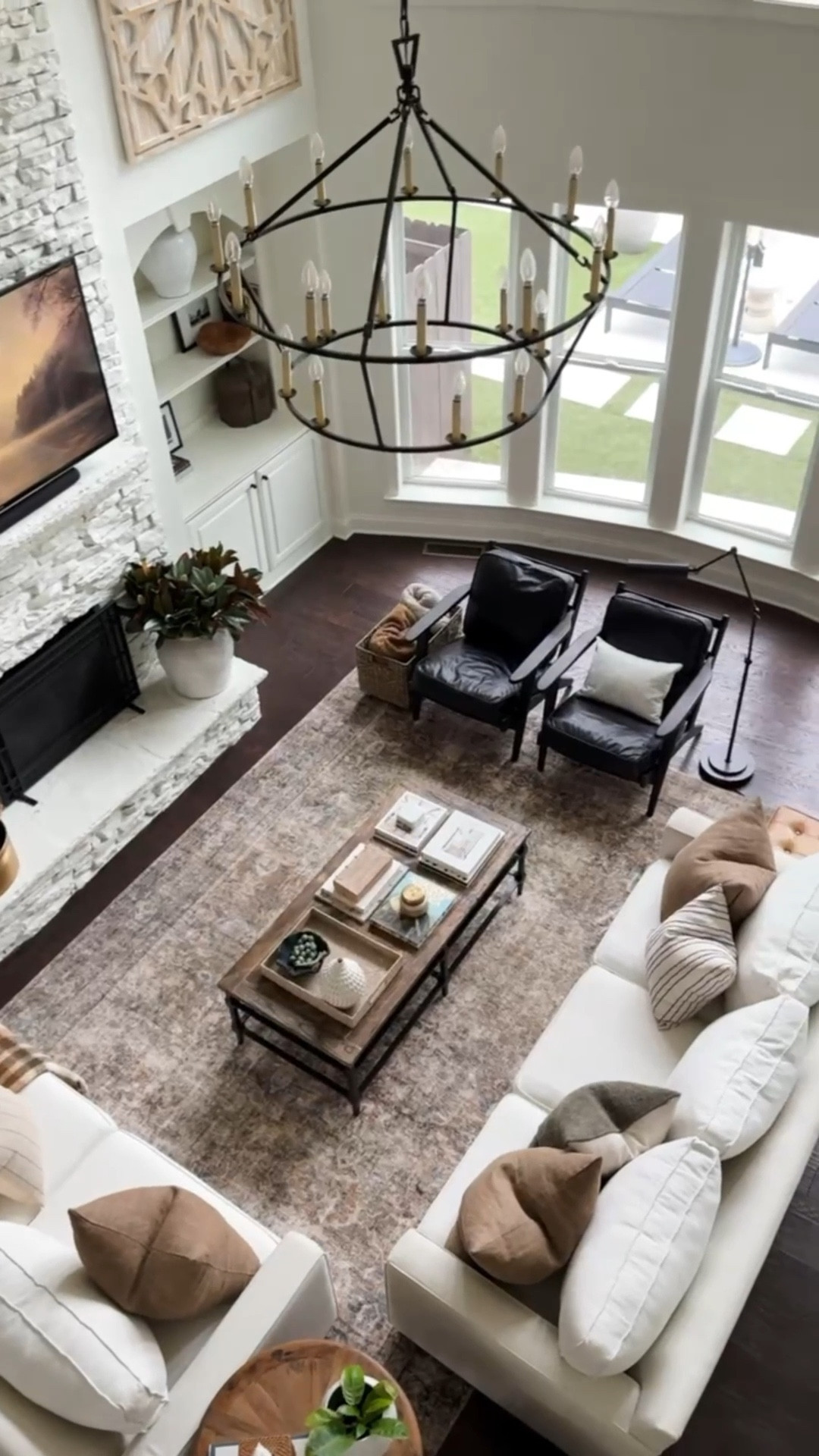 It feels so good to have Christmas put away and have a clean and fresh start to the new year with a change out to a warm neutral living room. home decor living room decor brown pillows plaid throw alabaster walls iron chandelier 

#LTKHome #LTKSeasonal