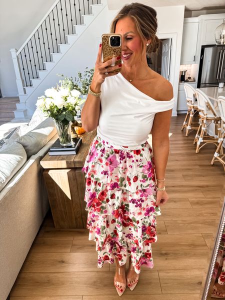 This outfit is beyond beautiful. I love the ruffle skirt. I’m wearing a size medium and a size large white top. Everything is on sale and you can get an extra 15% off with code AFSHORTS 

#LTKsalealert #LTKmidsize #LTKover40