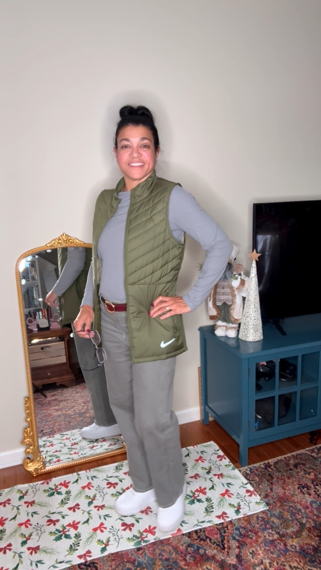 Gray monochromatic base with olive green Nike vest and burgundy Steve Madden belt for a pop of color. . 

#LTKootd #LTKCyberWeek #LTKWorkwear