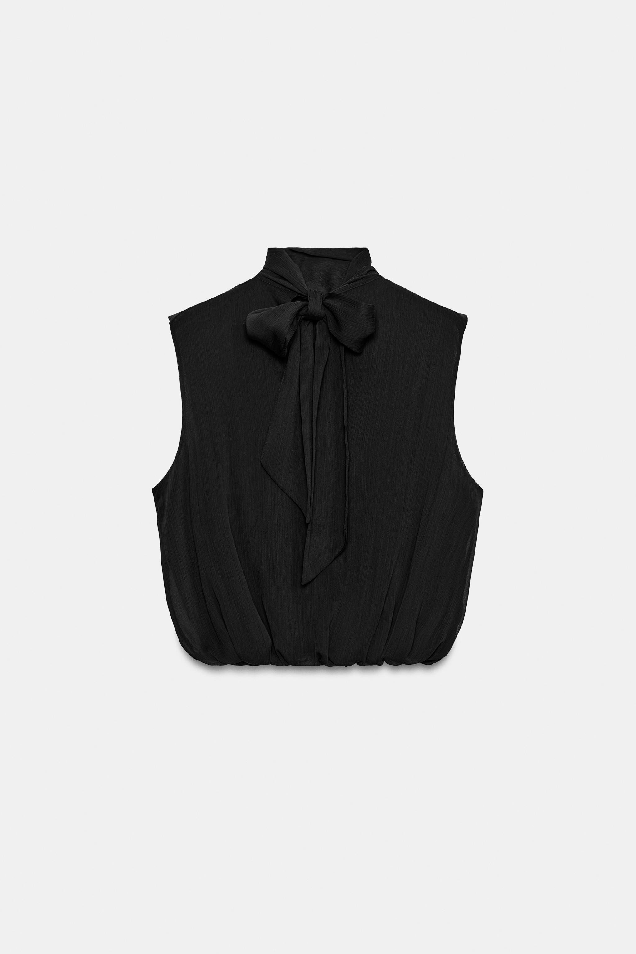 High neck top with a bow at the back. Crossover balloon hem at the front with an interior elastic... | Zara US