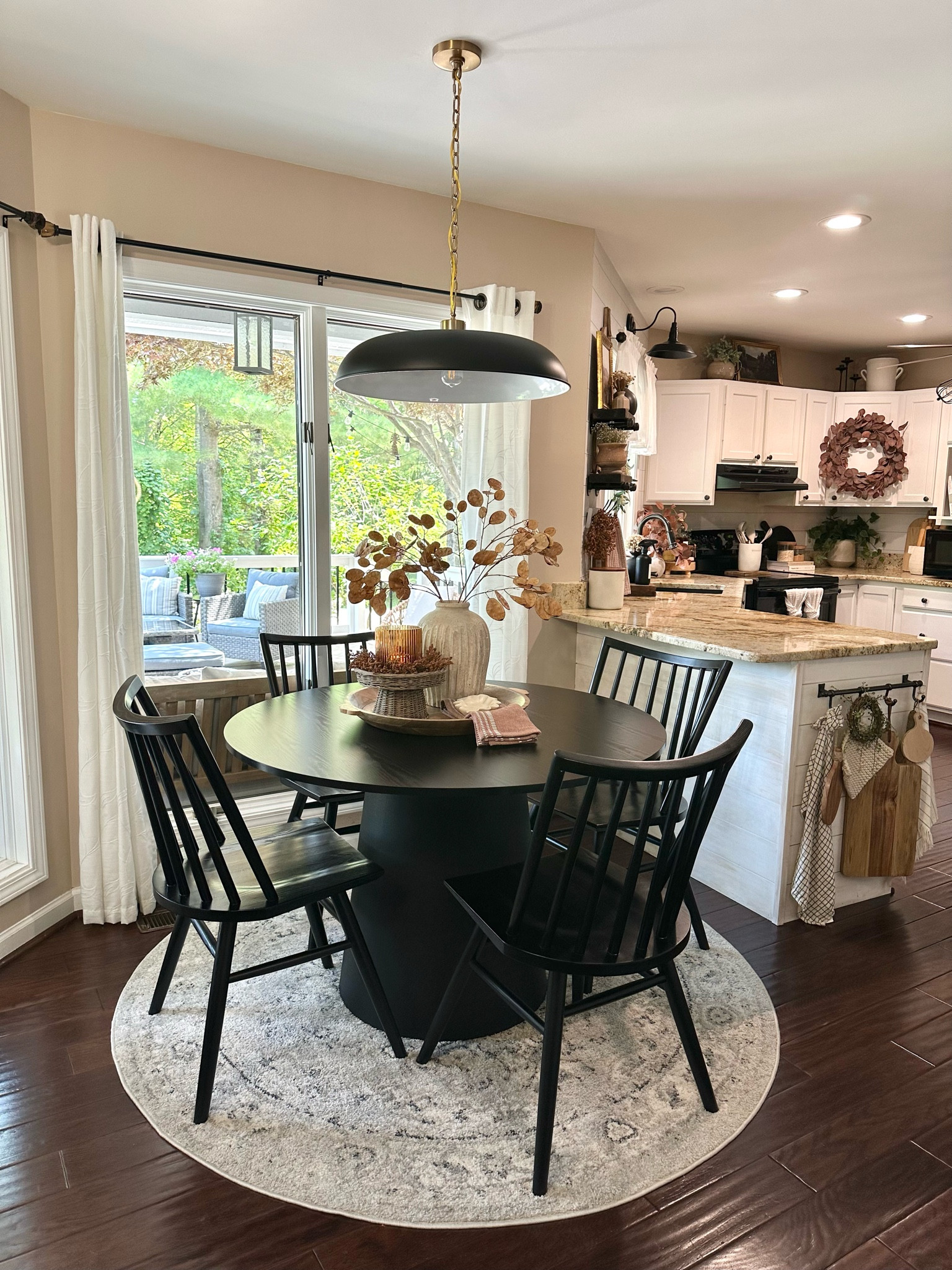 Breakfast Nook Inspiration. Follow @farmtotablecreations on Instagram for more inspiration. Round Pedestal Table. Black Chairs. Round Accent Rug. Pendant Light. Fall Centerpiece. Fall Decor. Kitchen Decor  

#LTKhome #LTKFind #LTKunder50