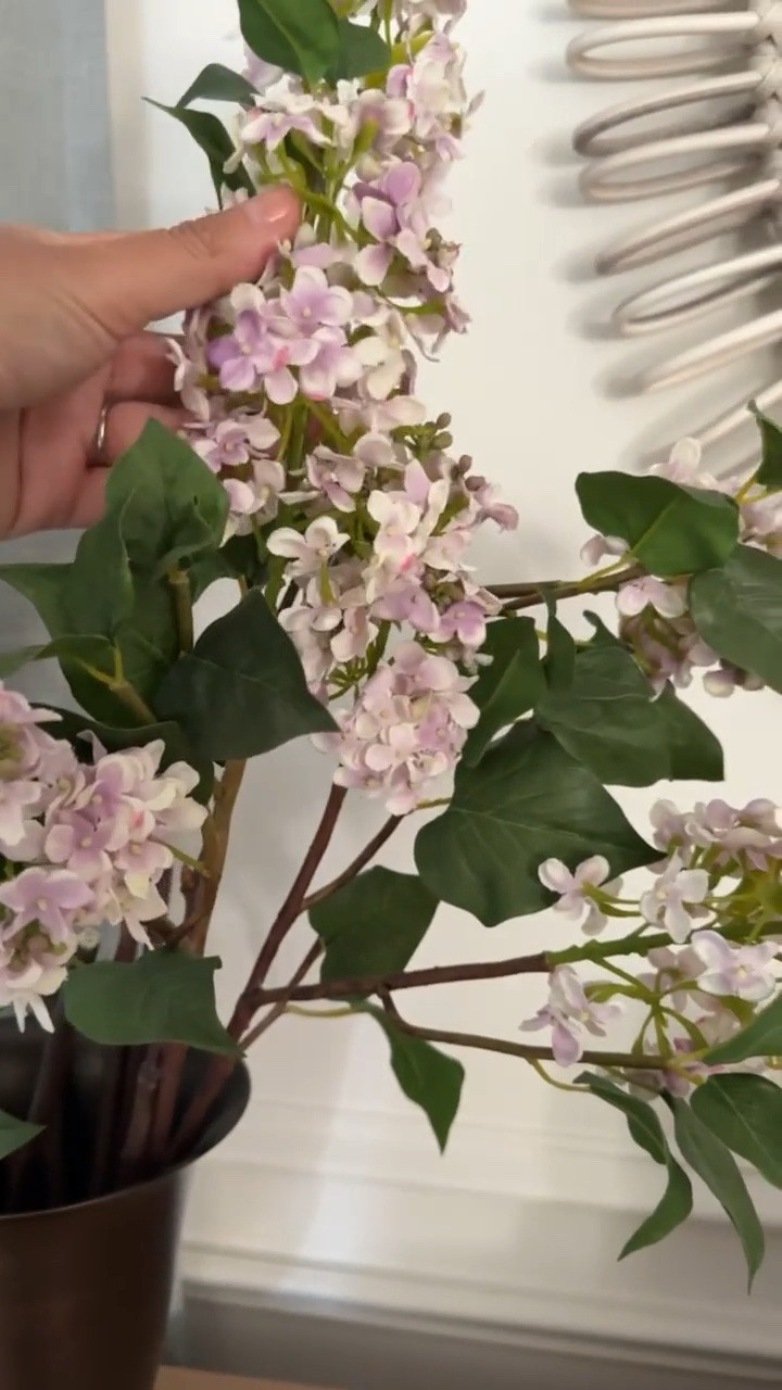 These faux lilacs add such a pretty touch of color and texture without needing any upkeep. They look so realistic styled in a vase and are an easy way to bring a little color into your home year round.

faux lilacs, faux flowers, artificial stems, home decor ideas, vase styling, floral decor, timeless home decor, coastal home, summer decor, living room styling, girlonthehudson

#LTKHome