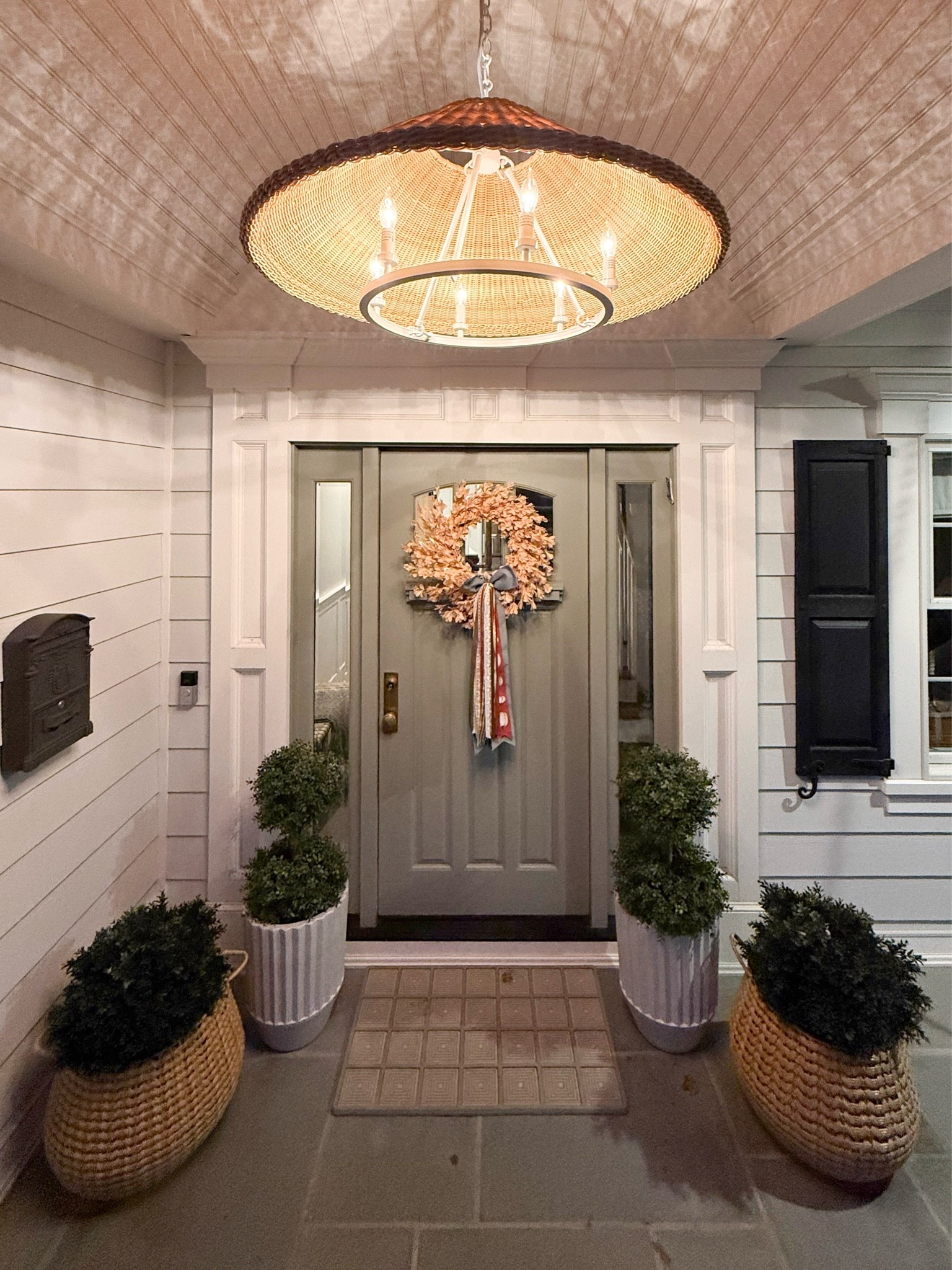 This front porch is giving the perfect coastal fall welcome. The woven planters, seasonal wreath, and statement lighting create such a warm and inviting entry without feeling overly themed.

fall front porch decor, coastal porch decor, outdoor lighting, fall wreath, porch planters, entryway inspiration, autumn home decor, seasonal decorating ideas, outdoor home decor, front door styling, cozy home exterior, girlonthehudson

#LTKHome #LTKSeasonal