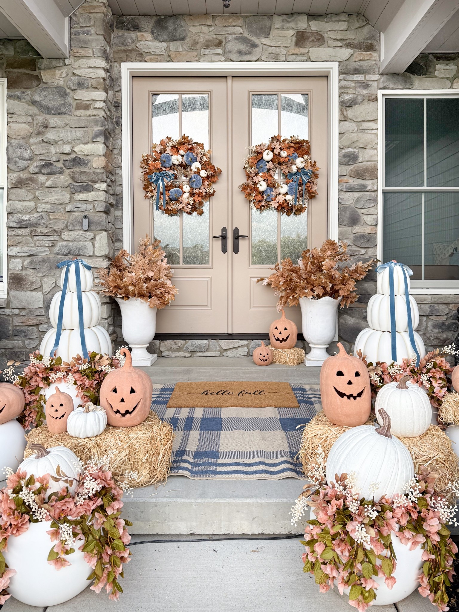 My Fall front porch! Filled with shades of terracotta, dusty blue and ivory. I linked as much as I could! My stunning wreaths are from The Accidental Farmgirl and you can use code BEYOND at checkout! The white pumpkins are all from Hobby Lobby (not linkable on LTK), along with the maple leaf stems, ivory berry picks and hay bales - check your local store. The tall tulip shaped planters were a HomeGoods find but my other white planters are linked (I have all 3 sizes). 

#LTKHome #LTKSeasonal