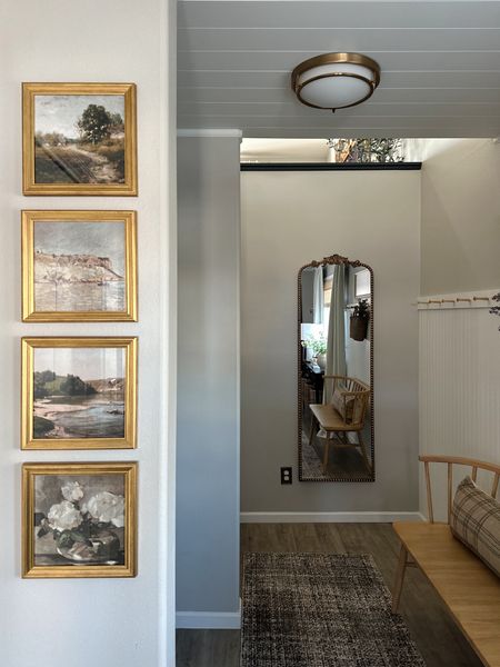 Adding a full length mirror to our entryway has been a game changer! 

Brass full length mirror, anthropology mirror dupe, Angela rose x Loloi runner, brown rug, brass picture frames, gallery wall, Etsy vintage art, white peg rail, entryway decor, target decor, affordable home decor, lumbar pillow, brass flush mount light, spring stems, pottery barn dupe curtains 

#LTKhome #LTKstyletip
