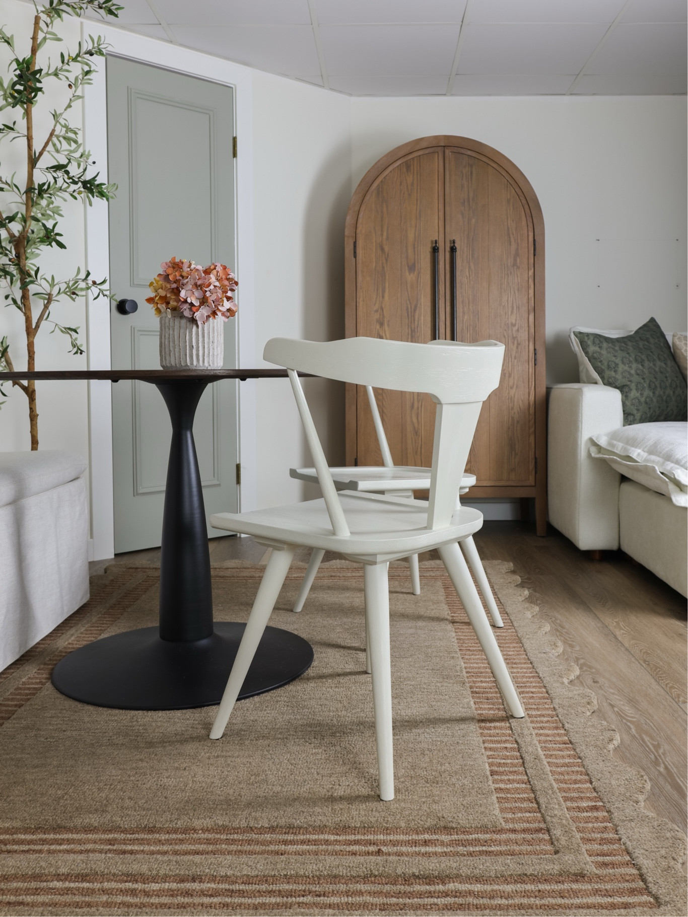 Round dining table, storage bench, white dining chairs, basement furniture, scalloped rug, loloi rugs, arch cabinet

#LTKHome #LTKFindsUnder100