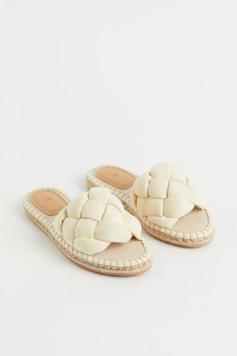 Conscious choiceEspadrille-style slides with a wide, braided foot strap in cotton twill, insoles ... | H&M (UK, MY, IN, SG, PH, TW, HK)