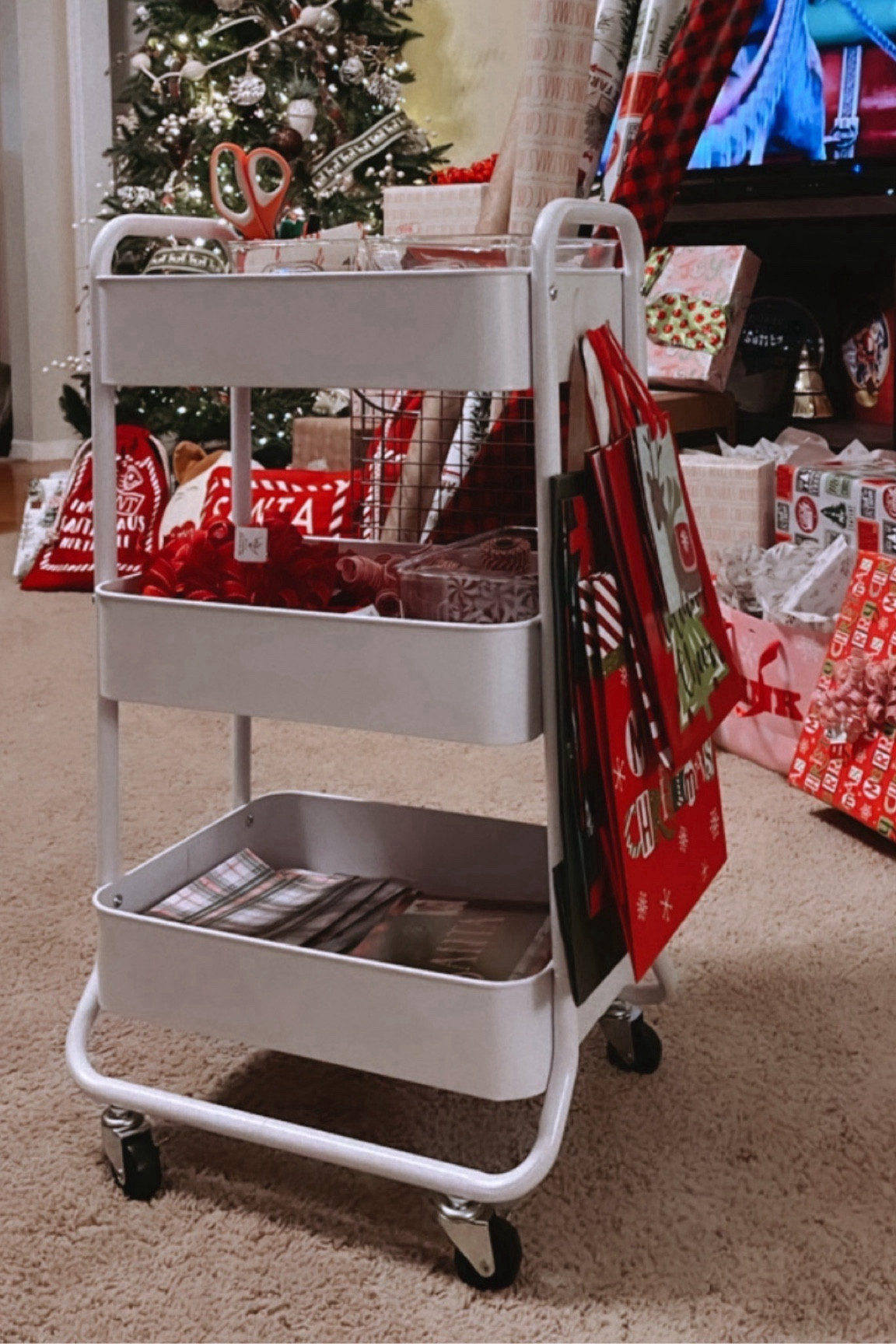 Wrapping Cart Station. Keep all your Christmas wrapping paper, scissors, tape, ribbons, name tags in one place - and easy to find! This has been a life saver for me! 

#LTKhome #LTKHoliday #LTKSeasonal