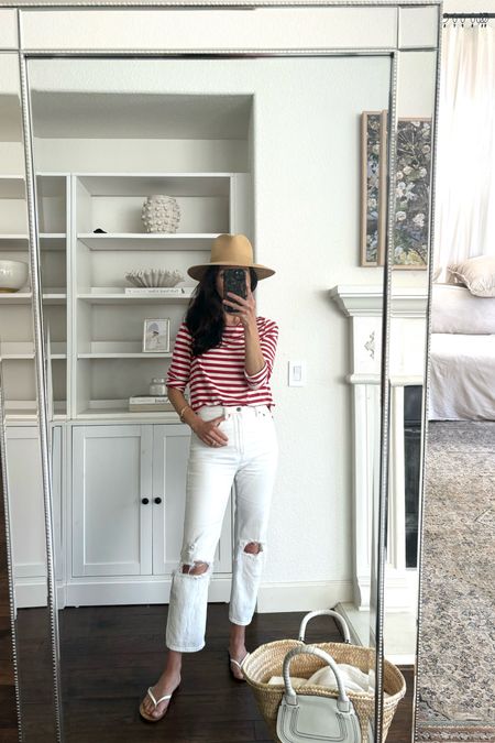 Headed out for Memorial Day in St.Helena (wine country).
1. Janessa Leone packable sun hat. Wearing a medium. 
2. Red and white striped cotton tee. Mine is Amour Vert. I’ll link a similar one since mine is old. 
3. White ultra high waisted ankle jeans. I just saw that the white might be sold out, but they come in cream and other washes. True to size. Wearing a 25. 
4. White leather sandals from J.Crew. 
5. Chloe bag in this raffia and white leather. 

4th of July outfit 
Patriotic outfit 
Best sun hat 

#LTKSaleAlert #LTKSeasonal #LTKOver40