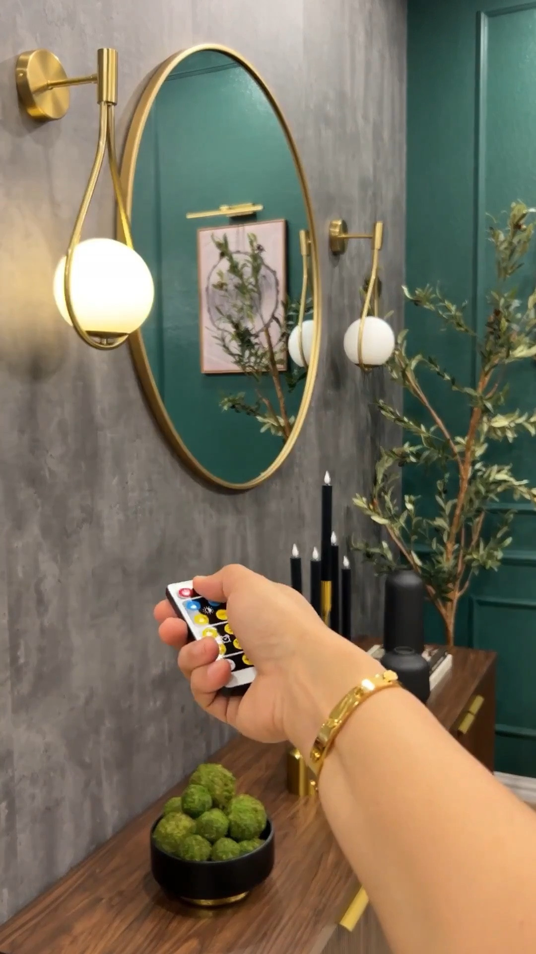 🖤 Moody, modern, and styled to tell a story.

This dark green living room came to life with a beautifully styled credenza featuring neutral candles, a sculptural moss bowl, and stacked coffee table books all framed by a gray concrete-style wallpaper that adds the perfect texture. I’ve linked every detail to help you recreate this elevated look.

#LTKSeasonal #LTKHome