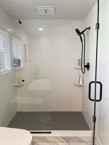 Client shower details:  clean and modern. 

Black shower fixtures.  White shower tile.  Gray hexagon mosaic shower floor tile.  Shower glass door.  

#LTKstyletip #LTKfamily #LTKhome
