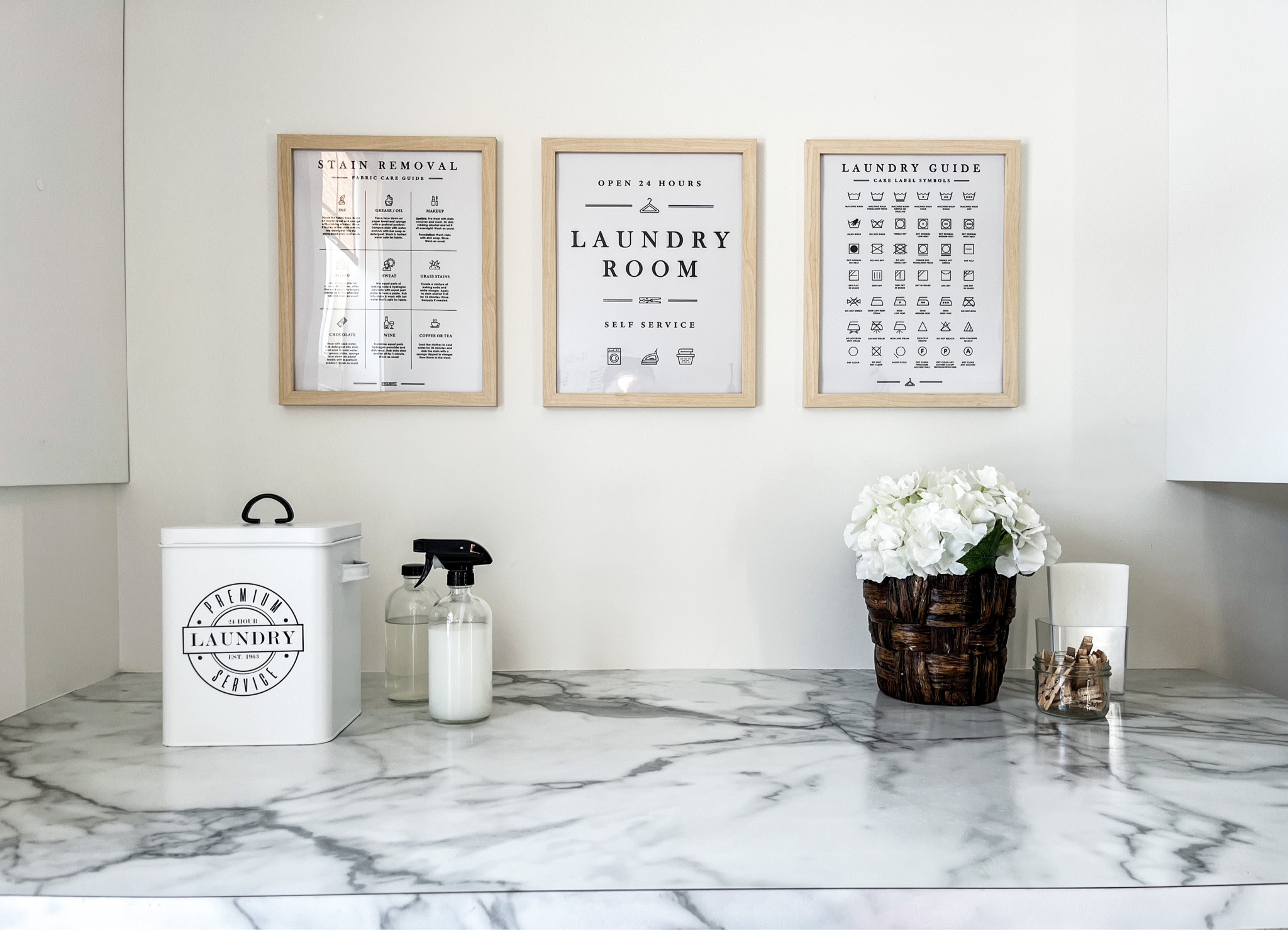 O R G / I was storing my vinegar in a mason jar, but the lid was rusting, so I switched to one of these glass dispenser bottles with a black plastic screw top. The narrow bottle top also makes it much easier to pour into the fabric softener dispenser of my washing machine. The spray nozzle is great for storing & spraying stain remover. I use the metal farmhouse style laundry soap bin to conceal, & contain my tide pods, & a small clear plastic storage container to store dryer sheets.

Amazon Canada | organization | laundry room | home decor 

#LTKunder50 #LTKstyletip #LTKhome