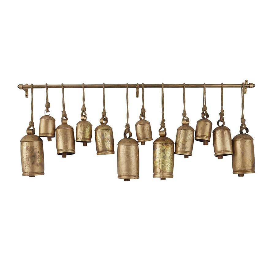 Deco 79 Metal Decorative Cow Bells Tibetan Inspired with 12 Bells on Jute Hanging Ropes and Rod, ... | Amazon (US)