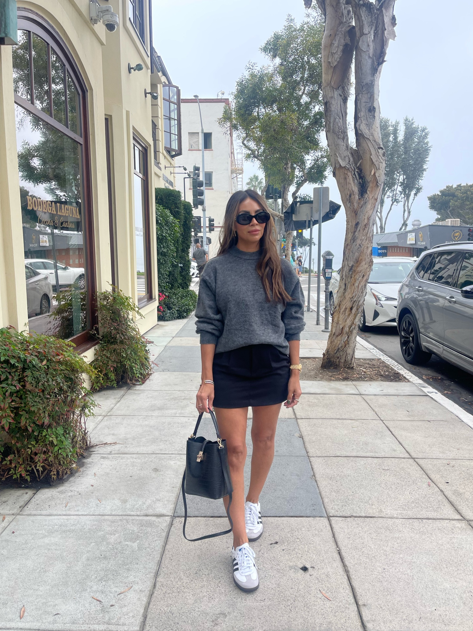 OOTD  sneakers size 5.5 men, sweater xs and size 2 in skirt // California // Laguna Beach // Fall break // Vacation // Cali love // Beach town // Fall outfit 

mini skirt 
Knit sweater 
adidas sambas 
bucket handbag 
black mini skirt 
oversized sweater 
Celine sunglasses 
sambas 
Trending sneakers 
outfit idea 
mom style 
fall outfits 

#ootd 
#miniskirttrend 
#sambas
#trendingsneakers 
#outfitidea
#fallfashion 
#falloutfitidea 
#momstyle 
#buckethandbag 
#celinesunglasses 
#adidas

#LTKtravel #LTKstyletip #LTKshoecrush