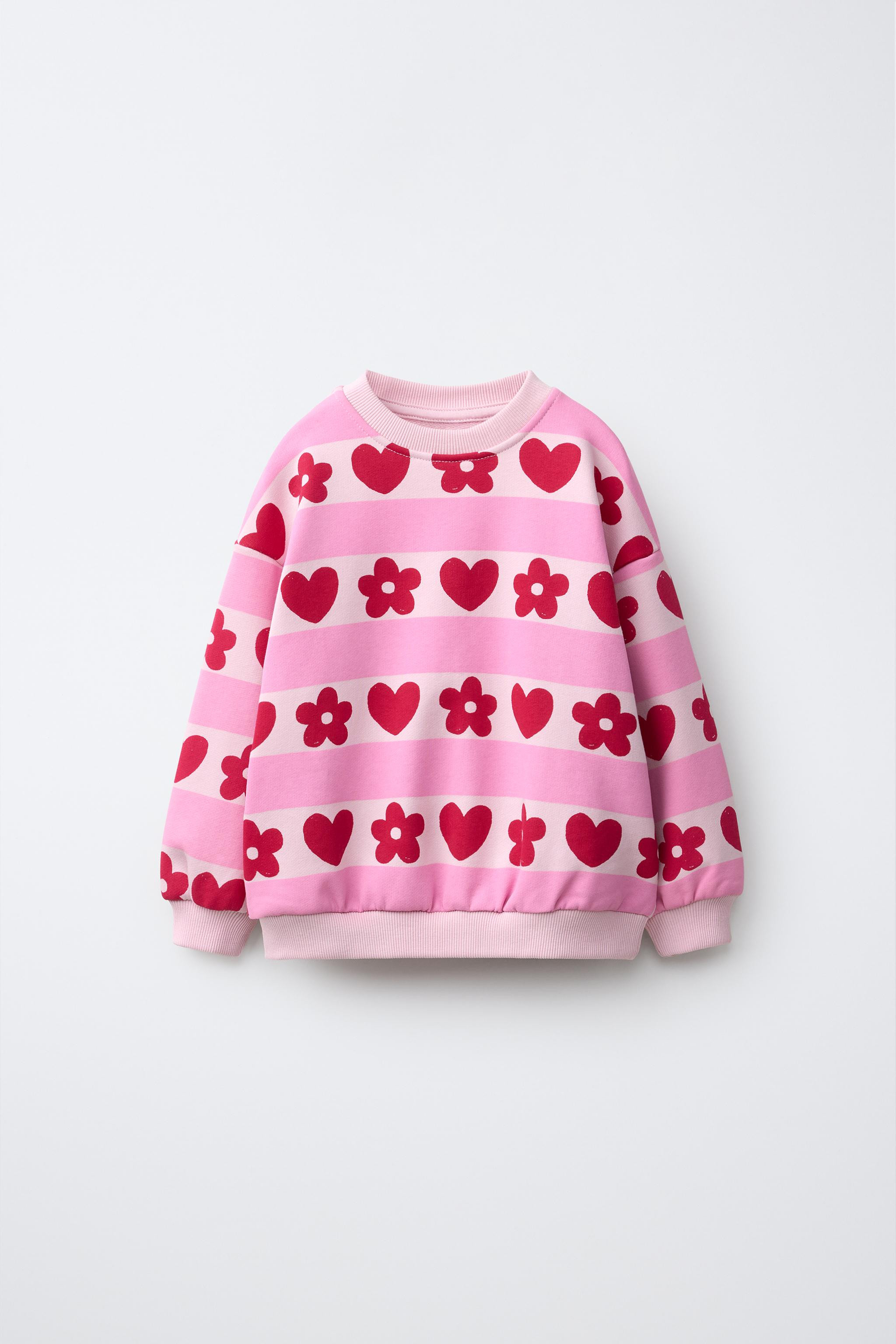 Sweatshirt with round neck and long sleeves. Ribbed trim. Striped and heart print. | Zara US