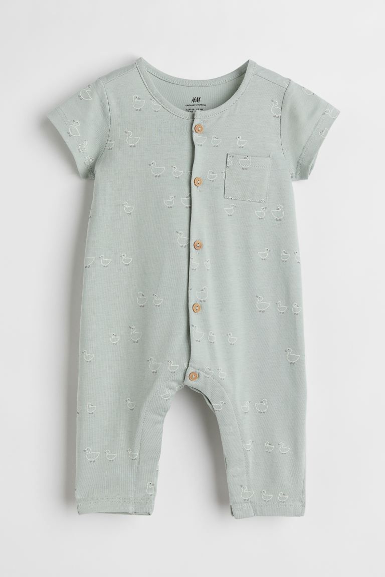 Short-sleeved romper suit in soft jersey with a printed pattern. Buttons at front and concealed s... | H&M (US + CA)