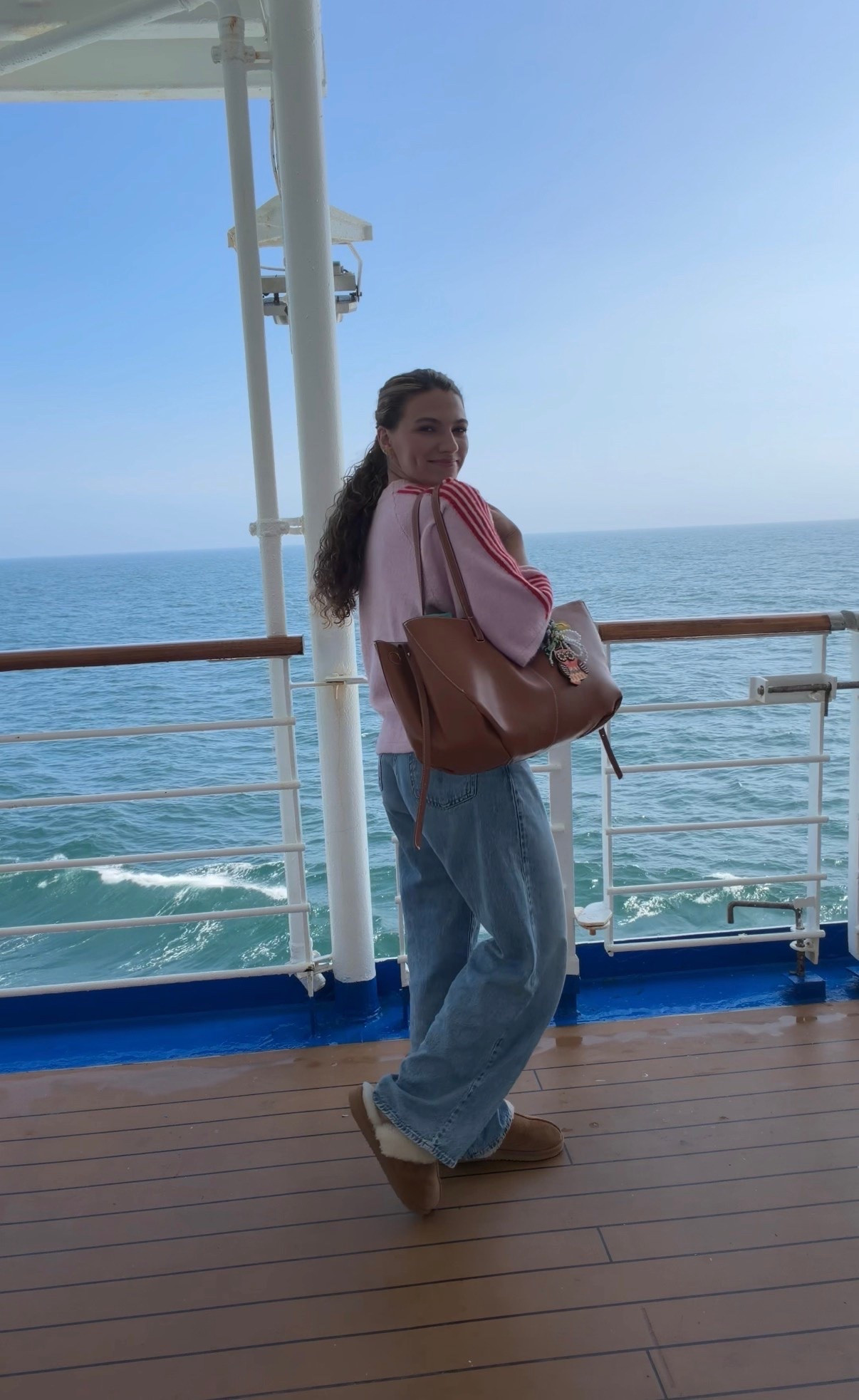Cruise sea day ootd - pink striped knit sweater with my favorite Levi’s cinch baggy jeans that are currently on mega sale!!!

#LTKootd #LTKTravel #LTKSaleAlert