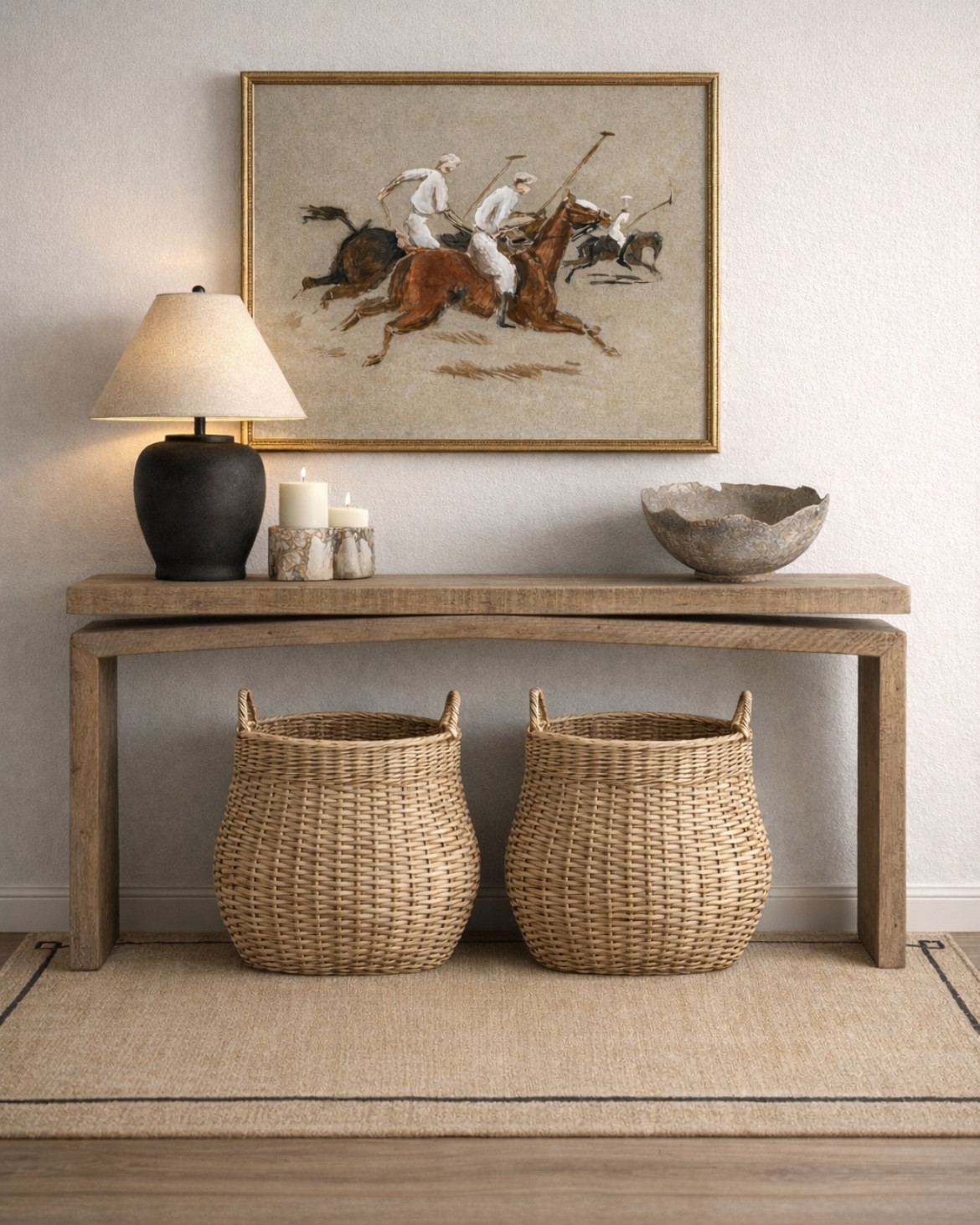 Home entryway with Neutral decor. Viral wood console table with storage baskets below. Large black ceramic lamp and polo themed equestrian art print. 

#LTKHome #LTKdayinmylife #LTKSaleAlert