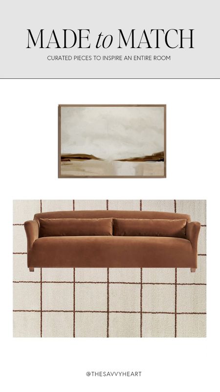 Transitional living room design with copper colored sofa, geometric checkered rug and abstract landscape art