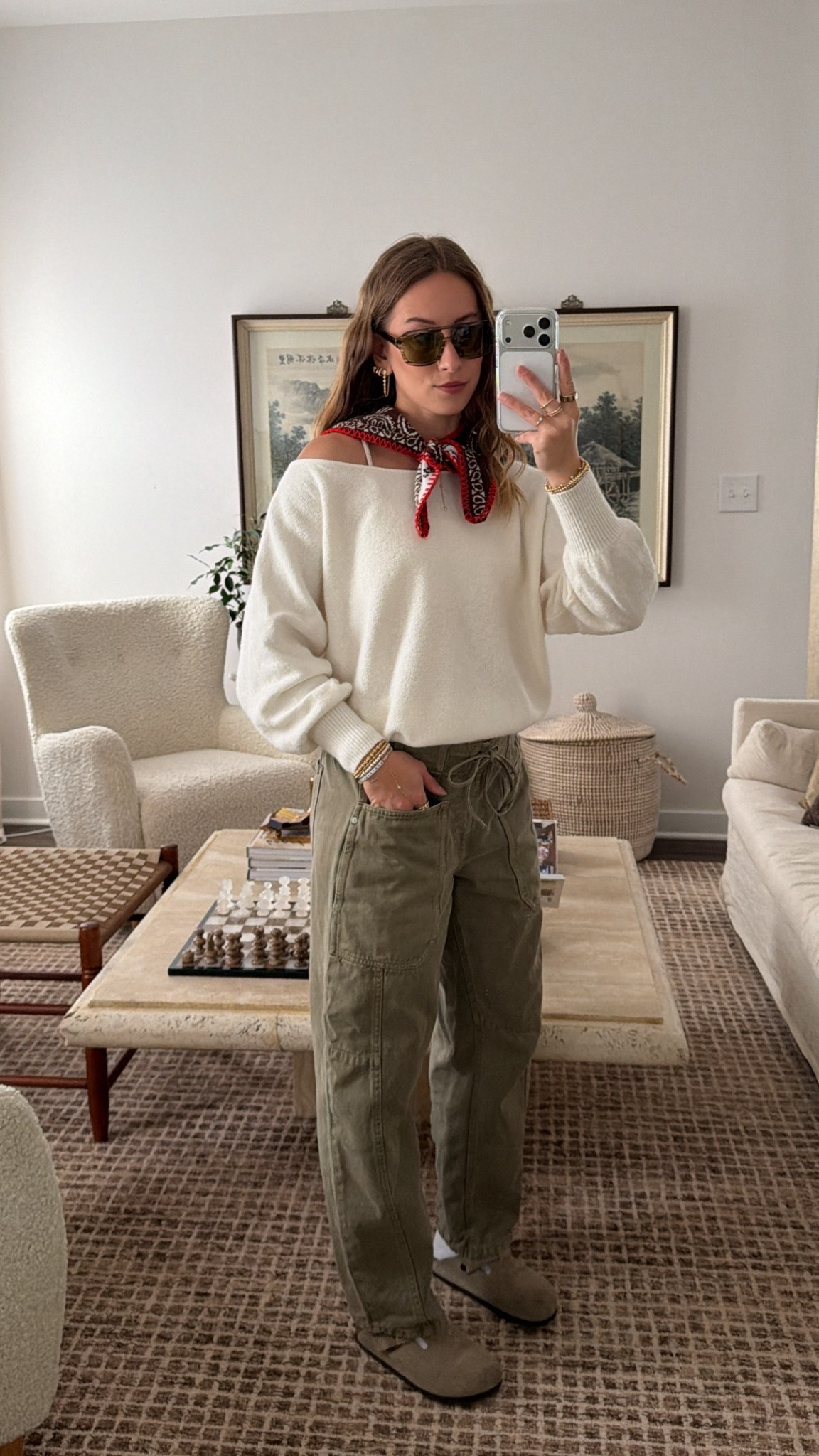 11/27/25 Casual Thanksgiving Day outfit inspo 🤎🍂
Wearing my Birkenstock Boston clogs, olive barrel pants I found at TJ Maxx (Scotch & Soda — sharing in case you get lucky!), my cozy Aritzia off-the-shoulder sweater, and my Free People neck scarf for a little extra fall detail.
Finishing it off with my Vela green sunnies and my go-to Amazon jewelry staples.

#LTKGiftGuide #LTKootd #LTKCyberWeek