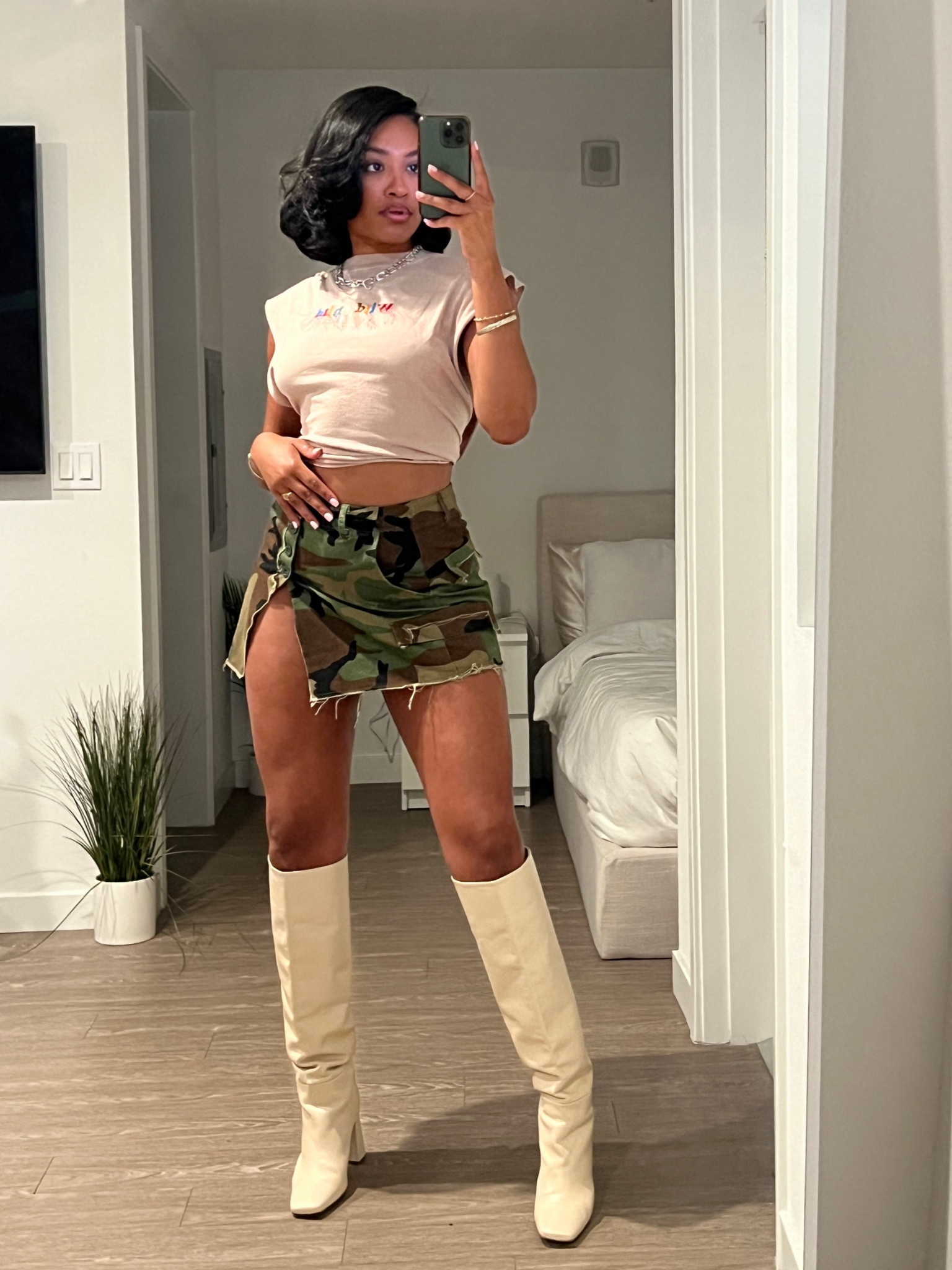 Love a good mini skirt and boot combination. Top and boots are sold out but mini camo skirt is now available on Amazon. I’m wearing a size small. 

#LTKunder100