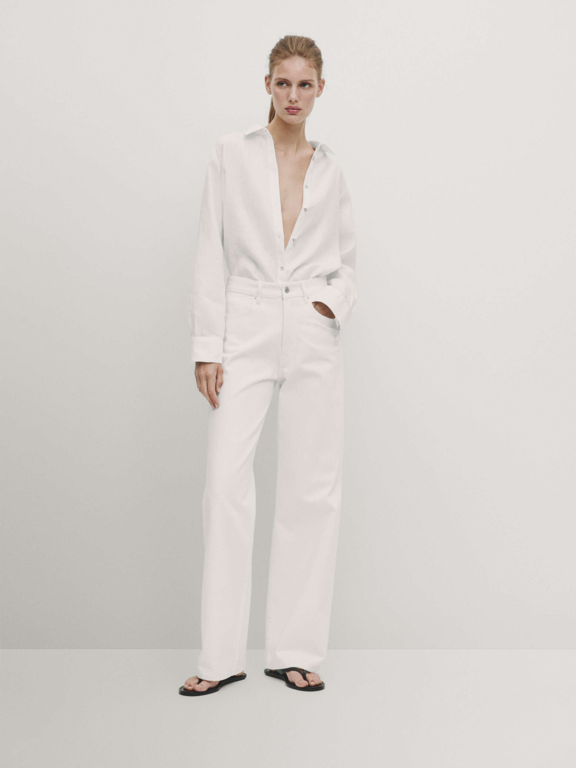 Wide-leg. High-rise. Waistband with belt loops. Front zip fastening concealed by a button placket... | Massimo Dutti US