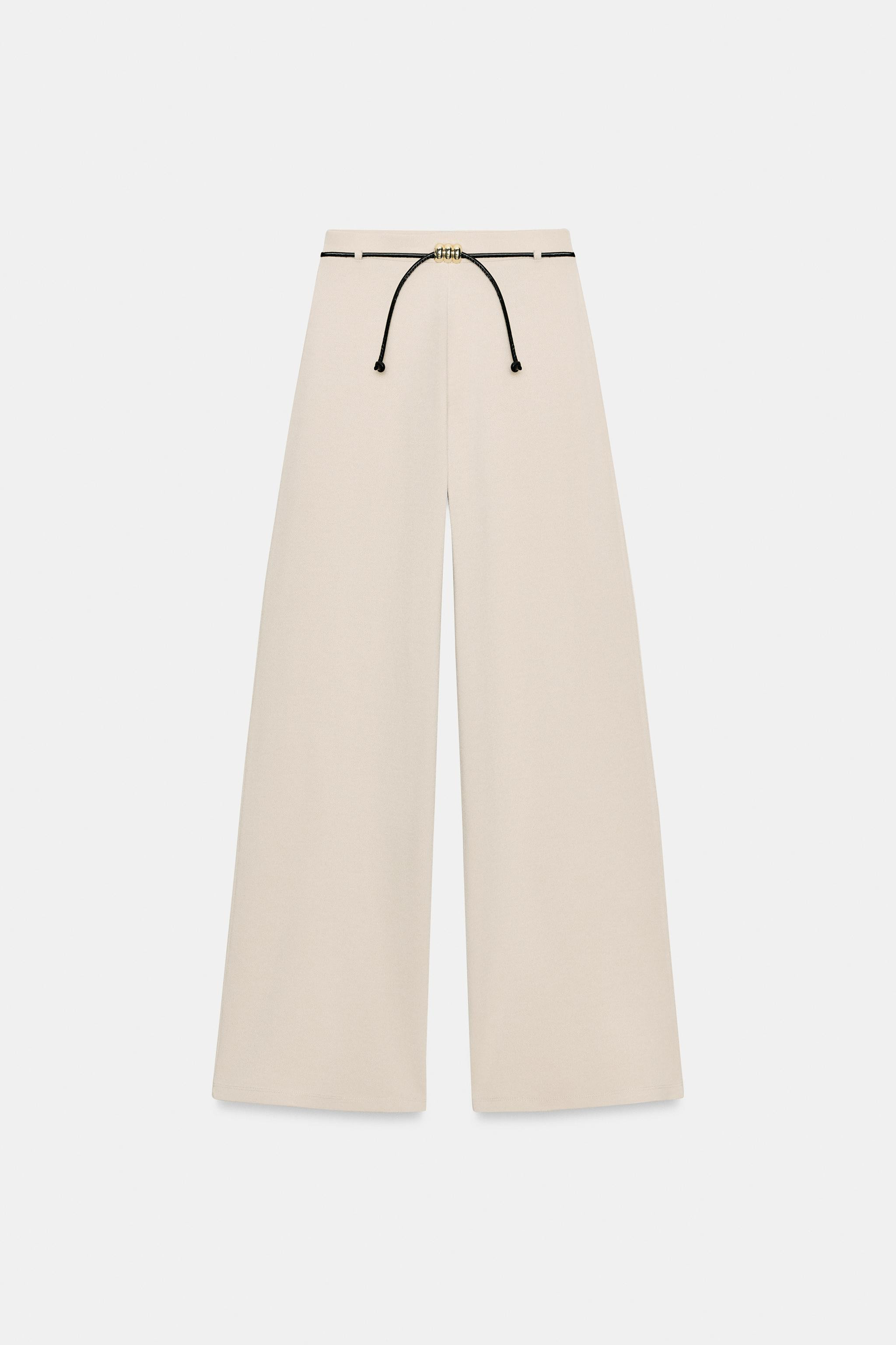 High-waist trousers with elastic waistband. Contrast combination belt with metal detail. Straight... | Zara UK