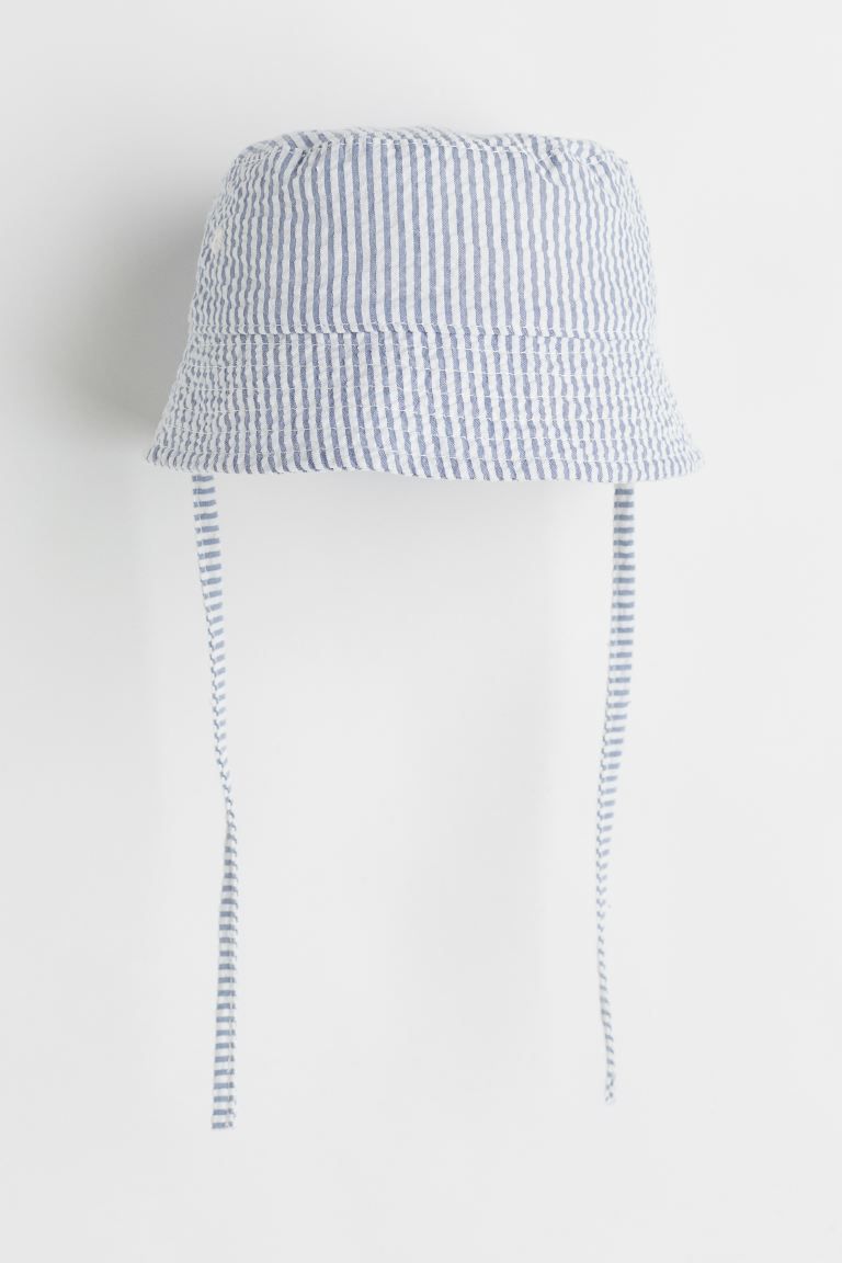 Sun hat in soft, woven cotton fabric with ties under chin. Lined. Width of brim 1 1/2 in.Composit... | H&M (US + CA)