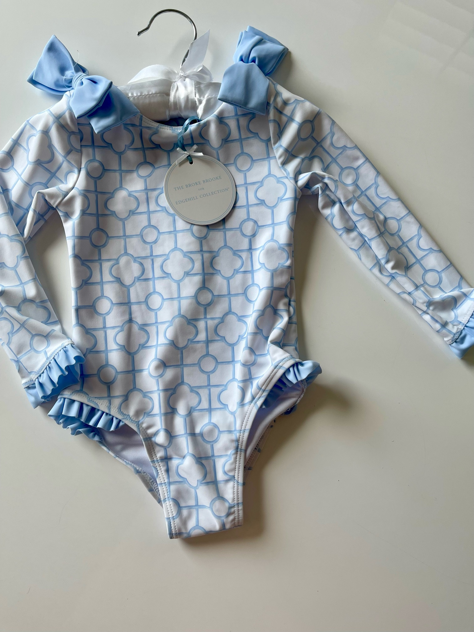 Precious rashguard swimsuit for babies and toddler girls
Trellis print with ruffle and bow detail bathing suit that’s affordable! Zipper back and just $28 matching boys version, too. 
Spring break bathing suits for babies and kids 


#LTKkids #LTKSeasonal #LTKbaby