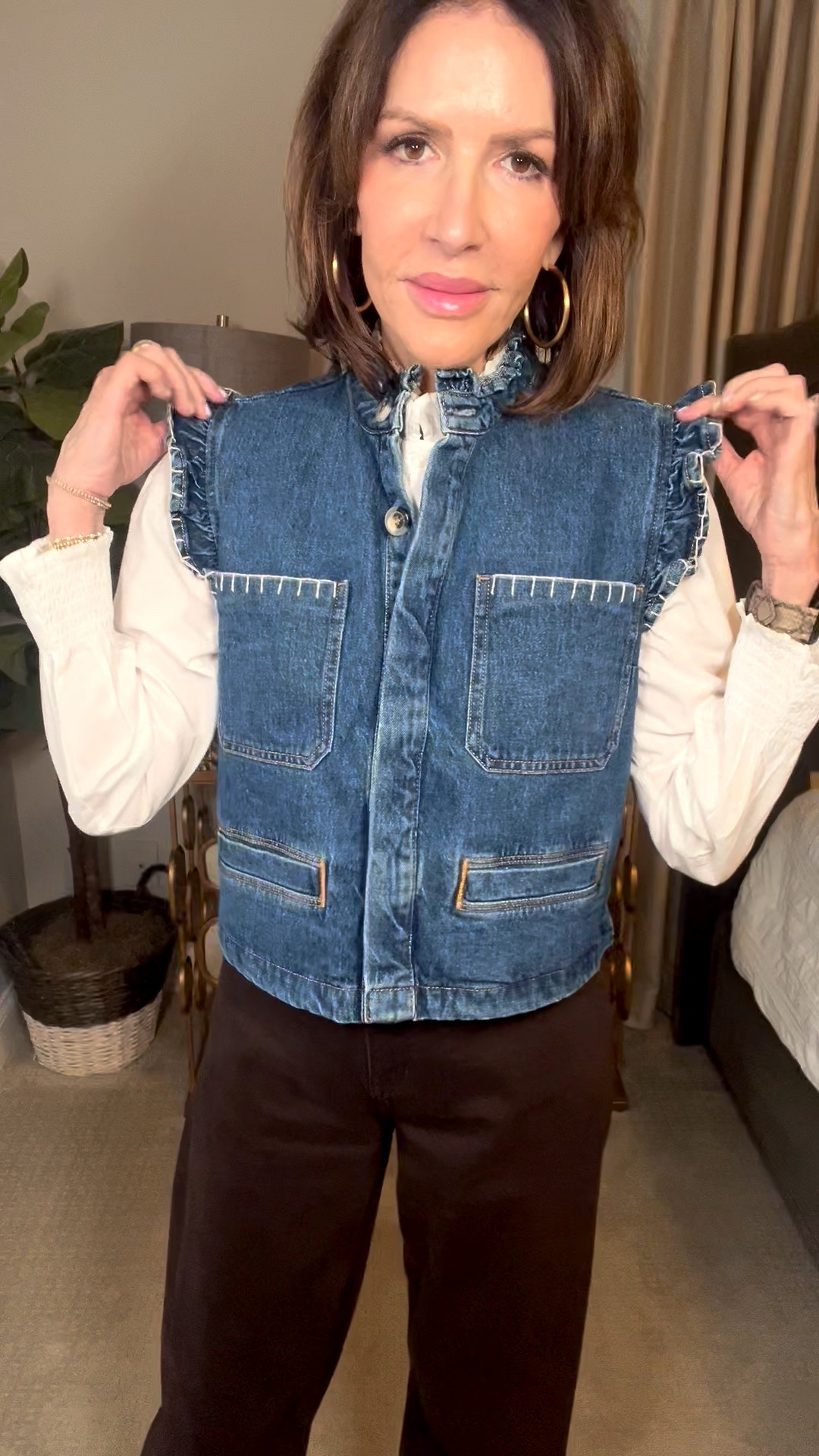 denim ruffle vest, ruffle white blouse, gold hoop earrings, brown wide leg pants, over 50 outfits 

#LTKootd #LTKOver40 #LTKSeasonal