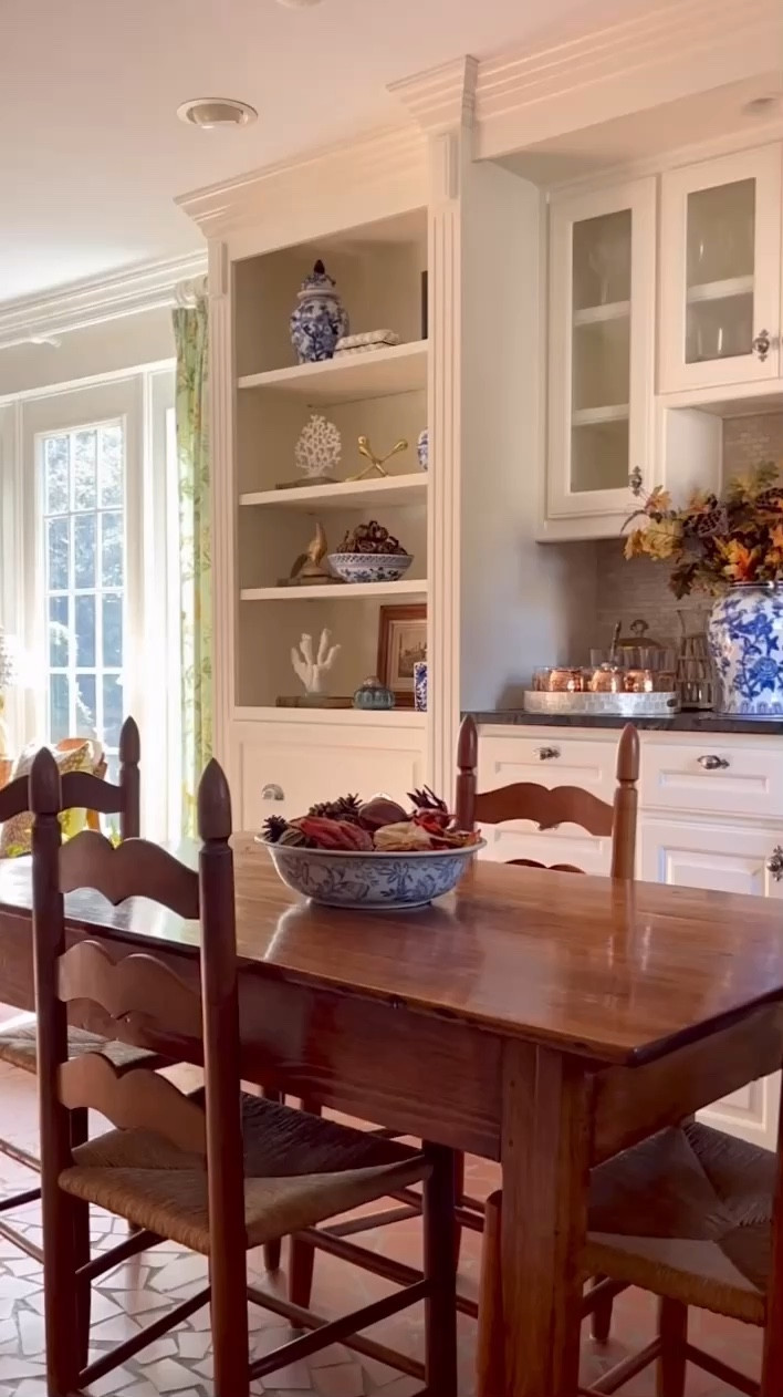 Fall magic is in the air... or is it? 🍂✨ Still waiting for those cooler temps to roll in before I dive into full-on fall decorating mode! In the meantime, taking a walk down memory lane, looking back at these simple autumn touches. Orange stems and potpourri, cozied up the bar space perfectly. 🍁 I love how they paired with the blue chinoiserie for that effortless seasonal contrast! 💙 Now, tell me—has fall arrived in your area yet, or are you still waiting like me?🍂

#AutumnHomeDecor #CozyFallVibes #SeasonalStyling #FallDecorInspo #FallTouches

#LTKStyleTip #LTKSeasonal #LTKHome