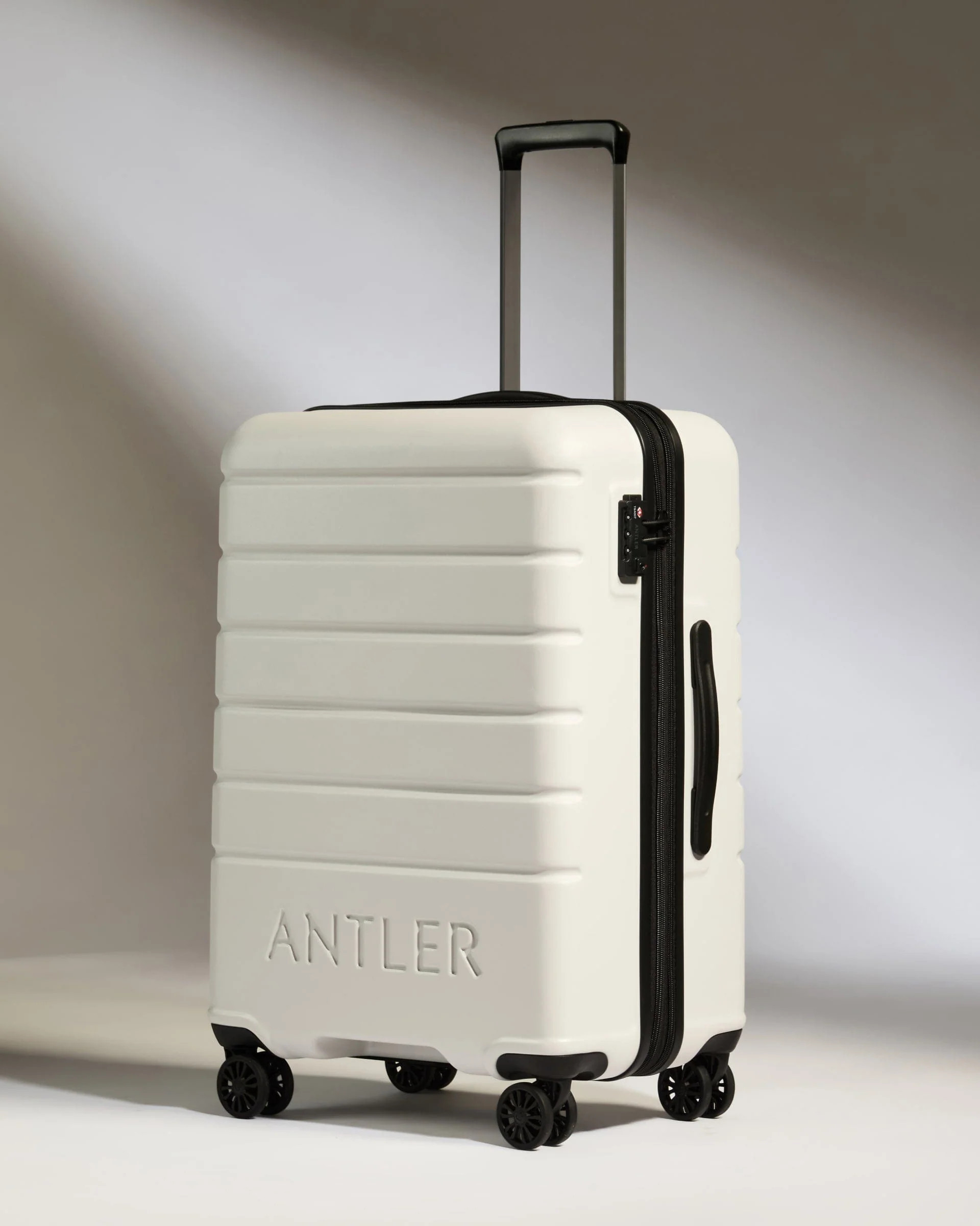 Medium Suitcase in Grey - Logo | Lightweight Hard Shell Luggage | Antler UK