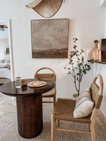 a dining nook breakfast moment 🍳 ☕️ 

dining table, bistro table, dining chairs, neutral rug, abstract art, throw pillow, faux citrus tree, rattan light fixture, neutral home, neutral home decor 

#LTKHome