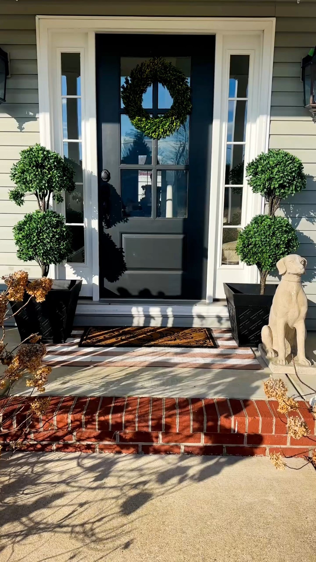 Love at the door 💕
A little vintage hospitality to set the mood—soft roses, delicate baby’s breath, and a wreath that feels straight out of a love story. Finished with vintage Valentine static clings on the side windows & bows on my topiaries because every detail deserves a moment. 💌🌹

#ValentineDecor #VintageValentine #DoorDecor #RomanticDetails
Valentine porch decor

#LTKHome #LTKFindsUnder50