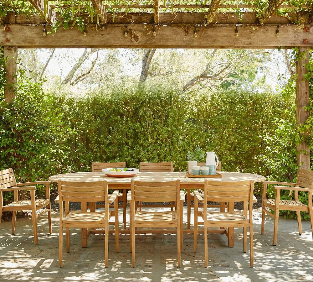 Nassau Teak Oval Outdoor Table with Monza Stackable Dining Armchair Set | Pottery Barn (US)
