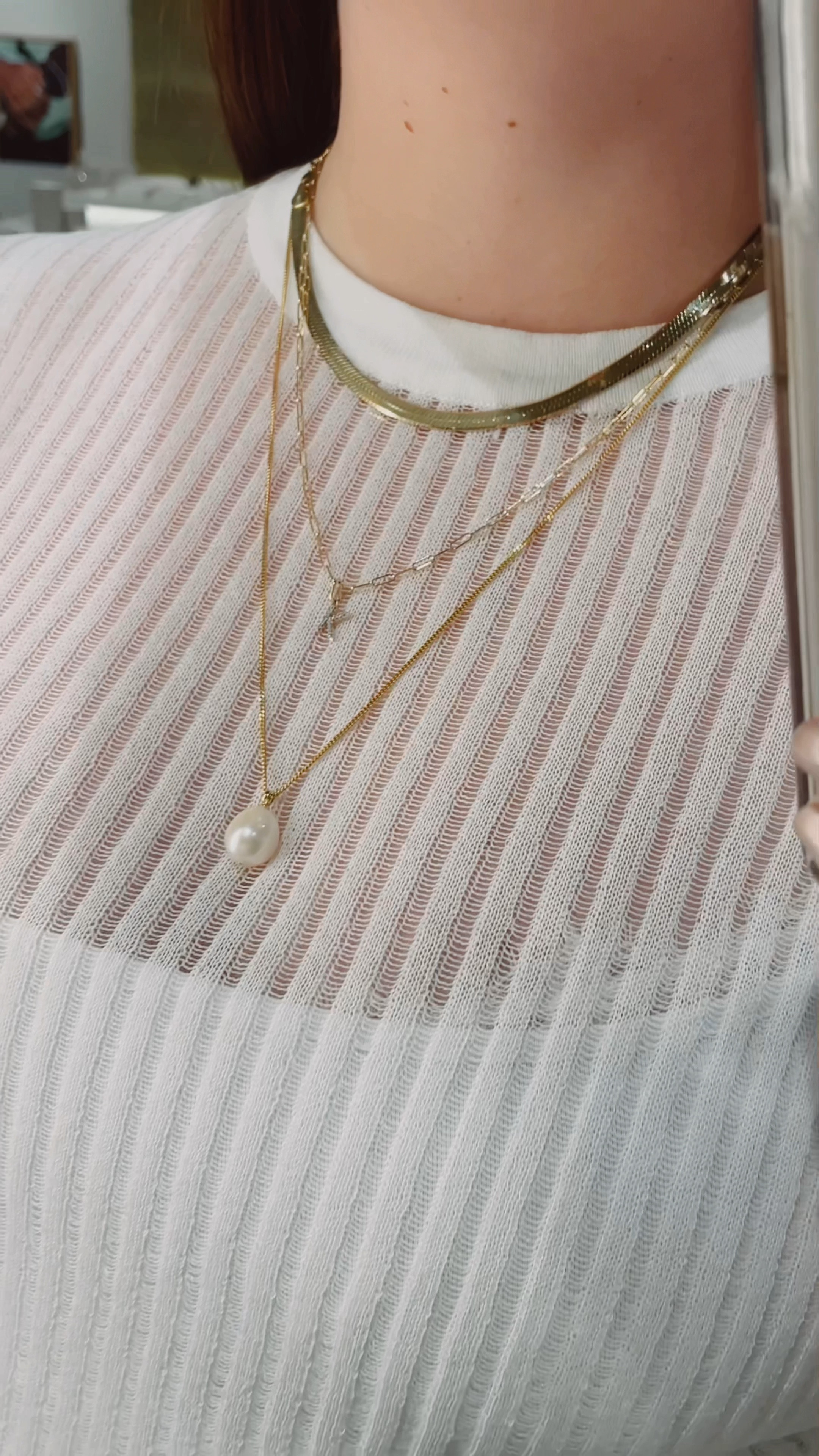 Gold necklace stack with solid gold and vermeil pieces.
Herringbone chain, Diamond initial necklace, and Pearl
pendant for a modern look

#LTKstyletip #LTKSeasonal