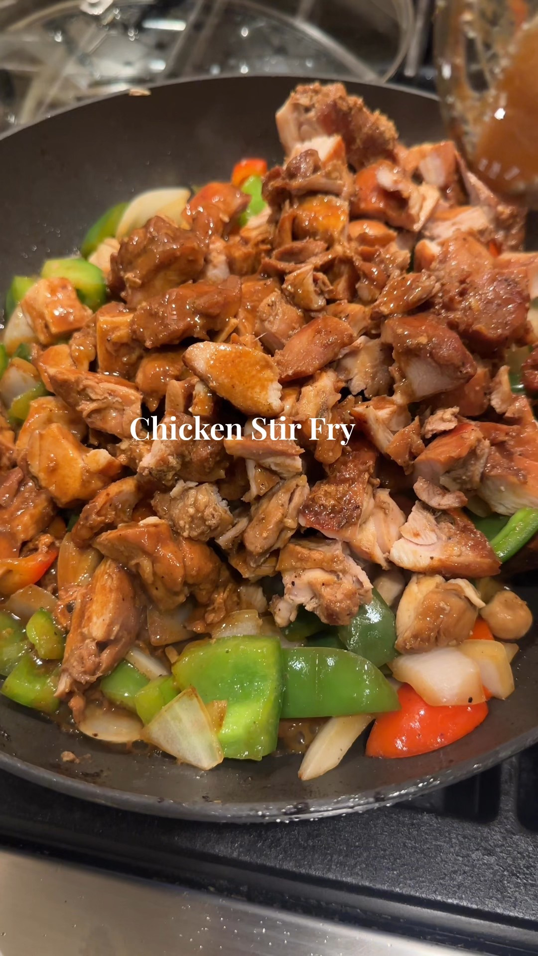 Chicken Stir Fry

2 lbs boneless skinless chicken thighs
1 cup green pepper, cut into 1 inch pieces
1 cup red pepper, cut into 1 inch pieces
1 cup onion, cut into 1 inch cubes
1 tsp garlic powder
1/2 tsp salt
1/2 tsp pepper 
2 tbsp Avocado oil

Marinade:
1/2 cup Kikkoman less sodium soy sauce
1 tsp sesame oil
3 tbsp hoisin sauce
1 tsp rice vinegar
3 cloves of garlic, minced
4 cups of cooked rice 

Here’s how you make it: 
1. Prepare the marinade and pour over chicken. Let marinade for 30 mins to 8 hours. 
2. To a wok add a dash of avocado oil and an even layer of the chicken. Let cook for 6 minutes, until golden brown. Flip, add any remaining marinade and cook for another 6 minutes, or until fully cooked. Remove, set aside. Repeat the process until all the chicken is cooked. 
3. To the pan add the veggies, season with garlic powder, salt and pepper. 
4. Let cook until softened, about 7 minutes. 
5. Meanwhile, dice up the chicken. Once veggies have softened add the chicken and their resting juices into the pan. Let bubble and cook for 10 minutes, stirring frequently. 
6. Taste for seasonings. Remove from heat. Add to a bowl over white rice. Top with soy sauce and green onions. 