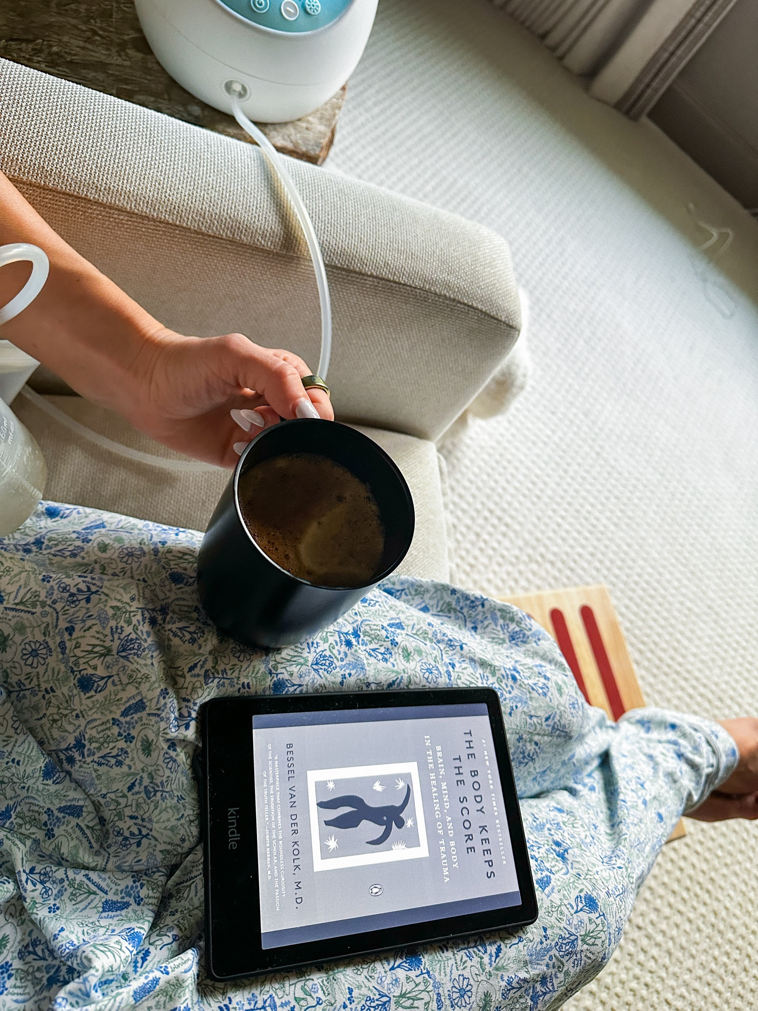 Pumping & nursing essentials - breastfeeding friendly PJs, coffee, a comfortable glider, a foot stool for the petite crew, and a kindle with a good book  

#LTKbump #LTKbaby