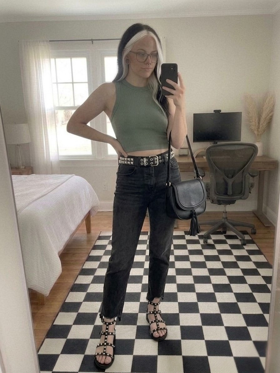 The perfect mix of grit and garden. 🌿 This ribbed sage crop top is the ultimate versatile base layer. It is tight enough for a clean silhouette but comfortable enough for all-day wear. I paired it with these charcoal high-waisted straight-leg jeans featuring that subtle V-cut ankle detail. It is the perfect way to show off your footwear!

To lean into the Vamp Romantic and Punk-Chic trends of 2026, I added a double-row studded pyramid belt and matching gladiator sandals. I finished the look with a classic leather tassel crossbody.

#LTKootd #LTKSeasonal #LTKMidsize